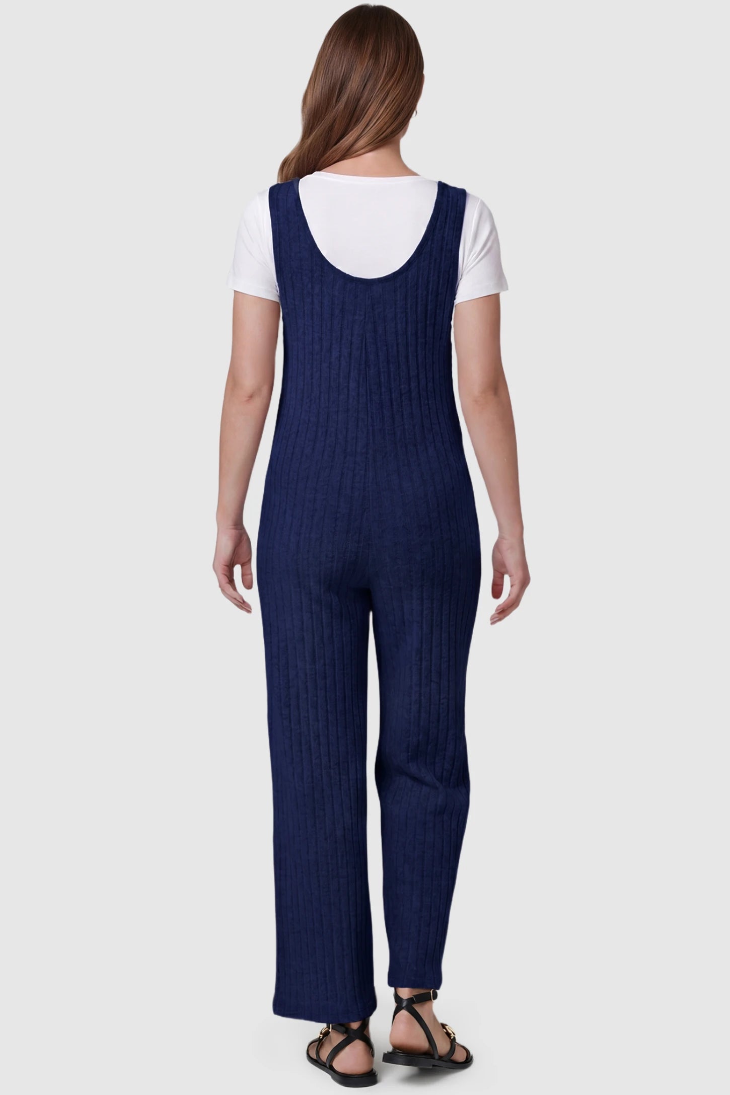 Ribbed Sleeveless Wide-Leg Maternity Jumpsuit Ribbed sleeveless wide-leg maternity jumpsuit in royal blue with sleeveless ribbed design, back view on pregnant model