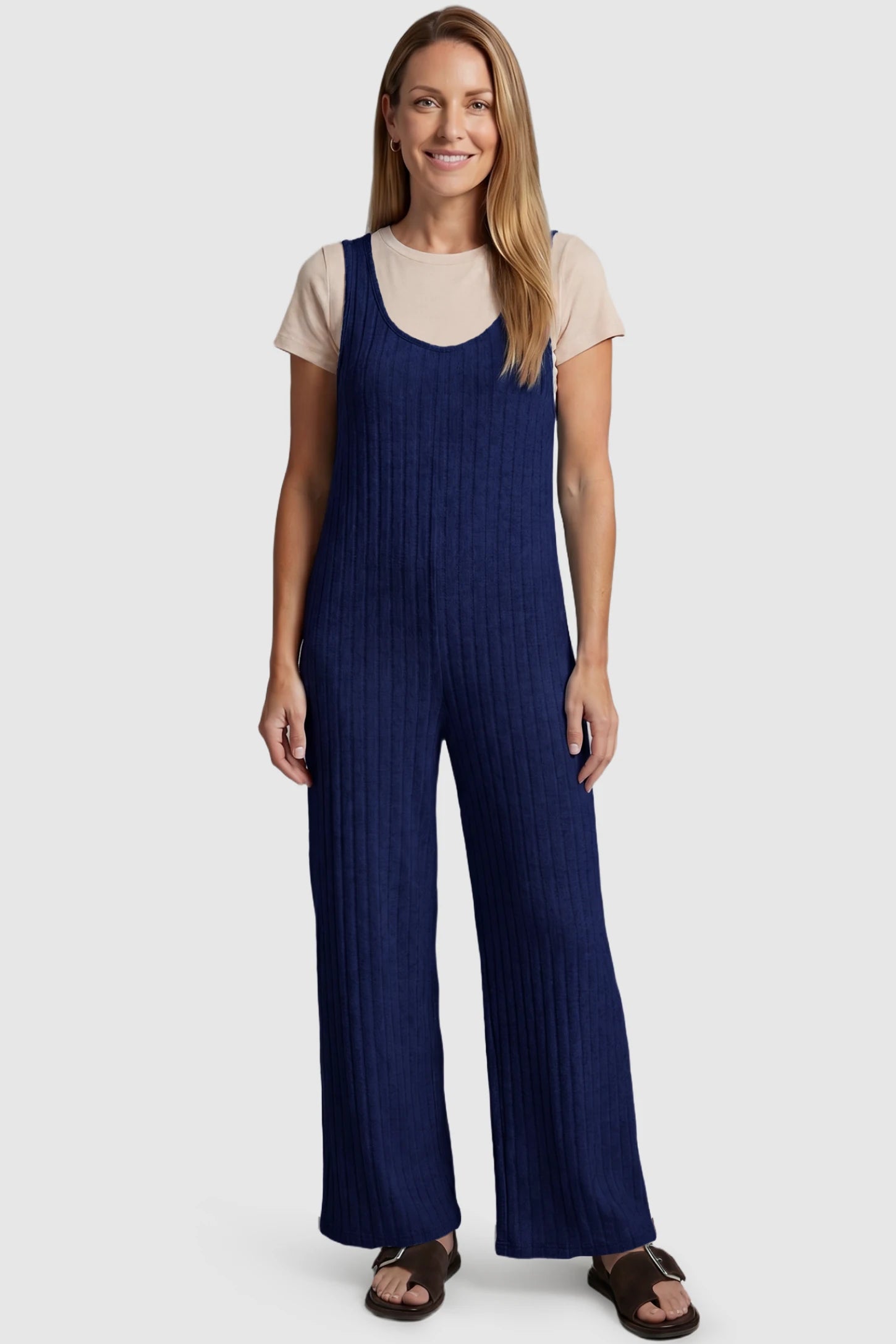 Ribbed Sleeveless Wide-Leg Maternity Jumpsuit Ribbed sleeveless wide-leg maternity jumpsuit in royal blue with sleeveless ribbed design, front view on postpartum model