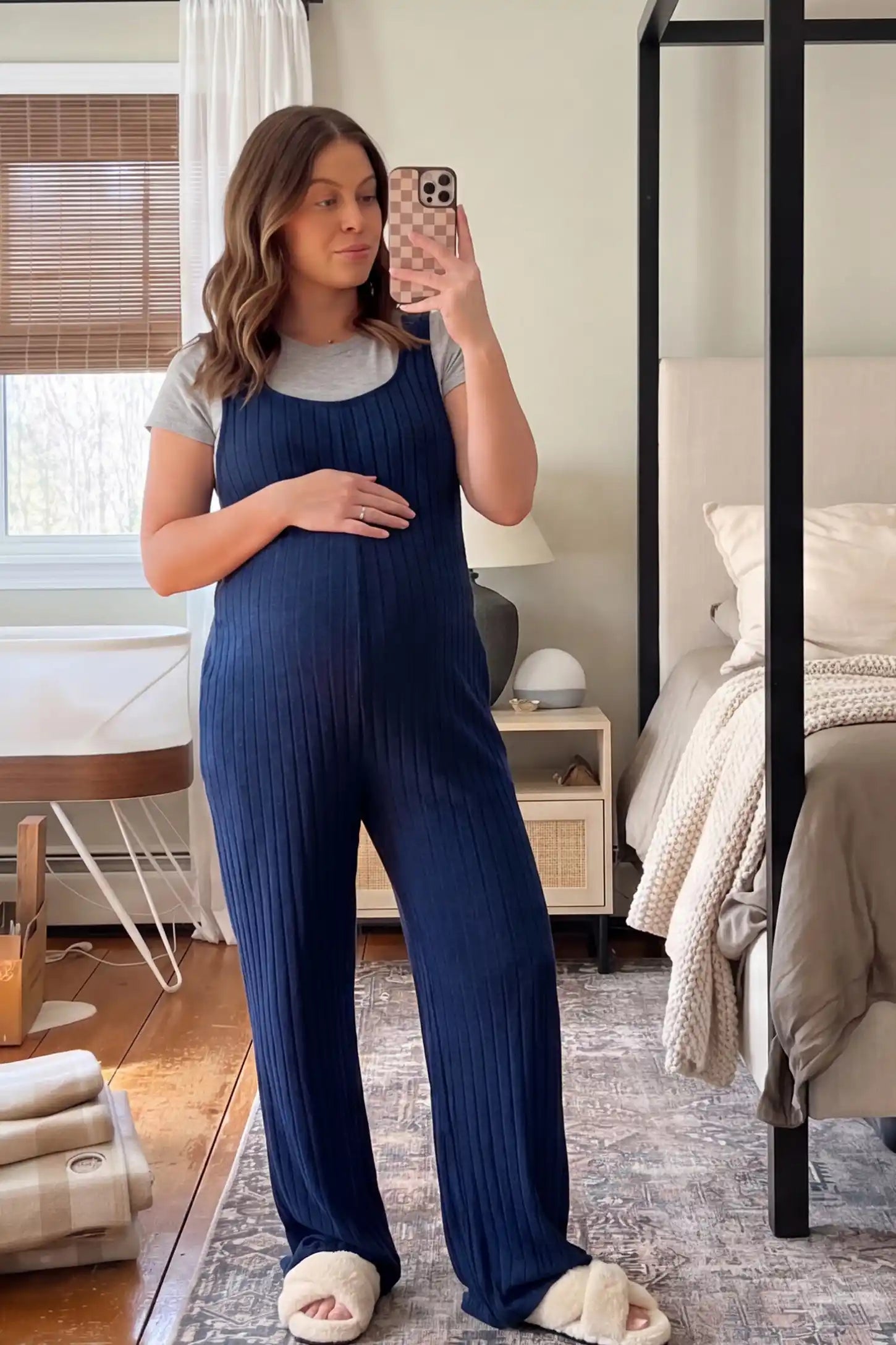 Ribbed Sleeveless Wide-Leg Maternity Jumpsuit Ribbed sleeveless wide-leg maternity jumpsuit in royal blue with sleeveless ribbed design, front view on pregnant model