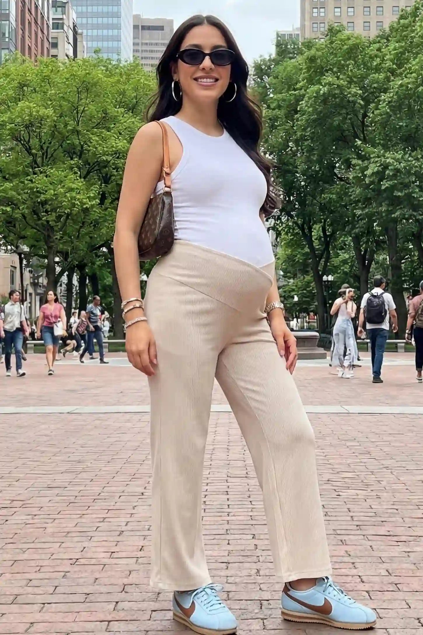 Adjustable Waistband High Waisted Wide-Leg Maternity Pants Adjustable waistband high waisted wide-leg maternity pants in beige featuring relaxed flowing silhouette in full body view on a editorial lifestyle model