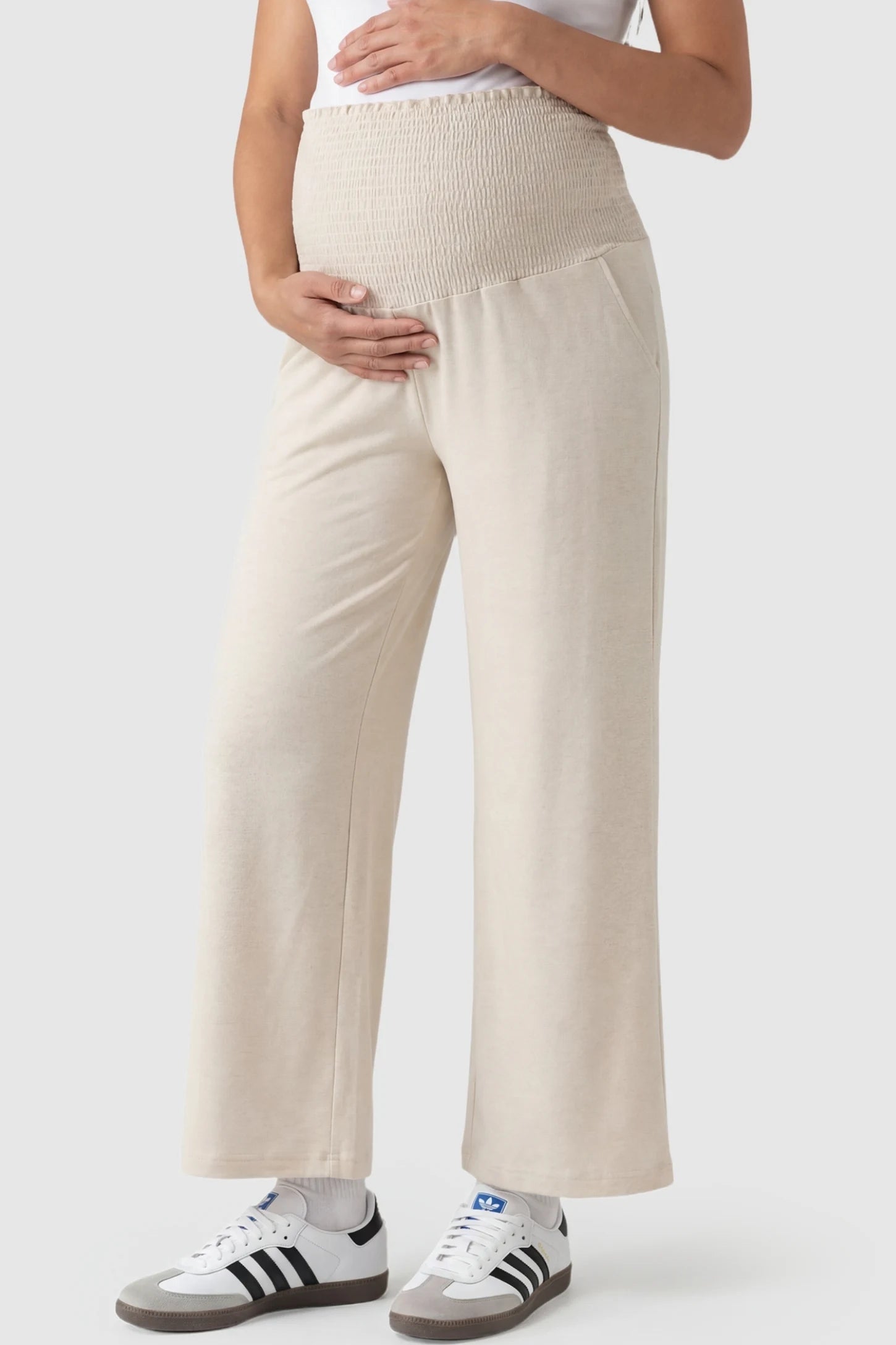 Stretch Waistband High-Waist Wide-Leg Maternity Pants High-waist wide-leg maternity pants in beige with stretch waistband, front view on pregnant model