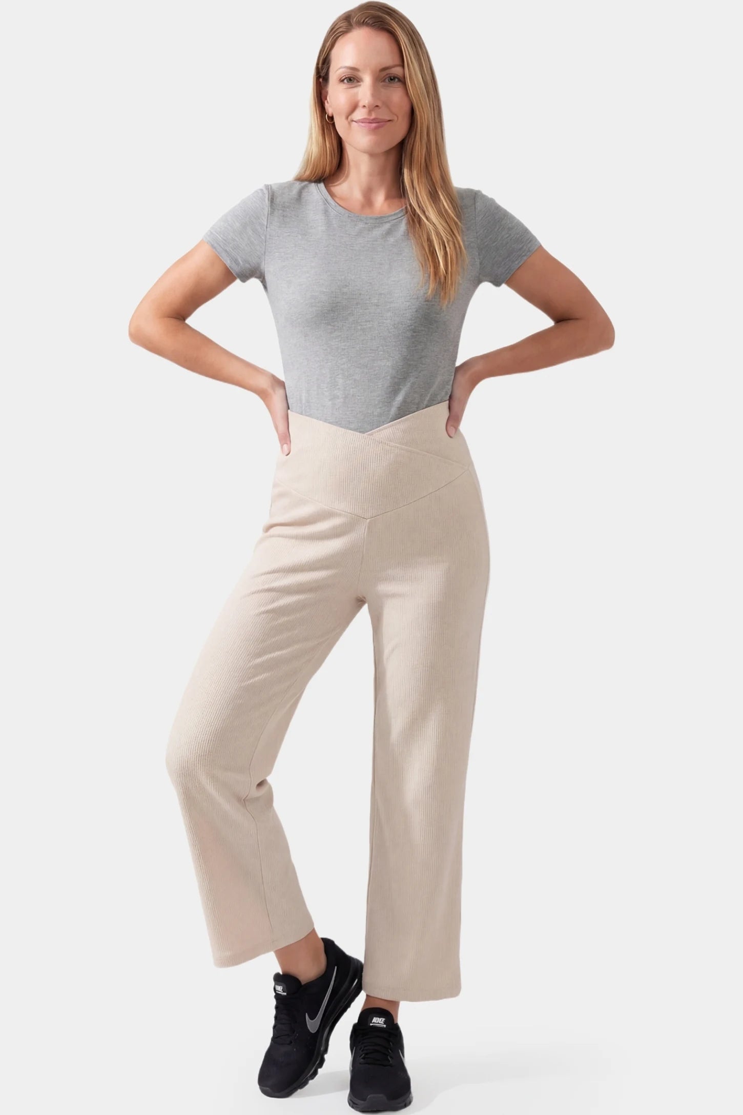 Adjustable Waistband High Waisted Wide-Leg Maternity Pants Adjustable waistband high waisted wide-leg maternity pants in beige featuring versatile everyday styling in full body view on a postpartum model