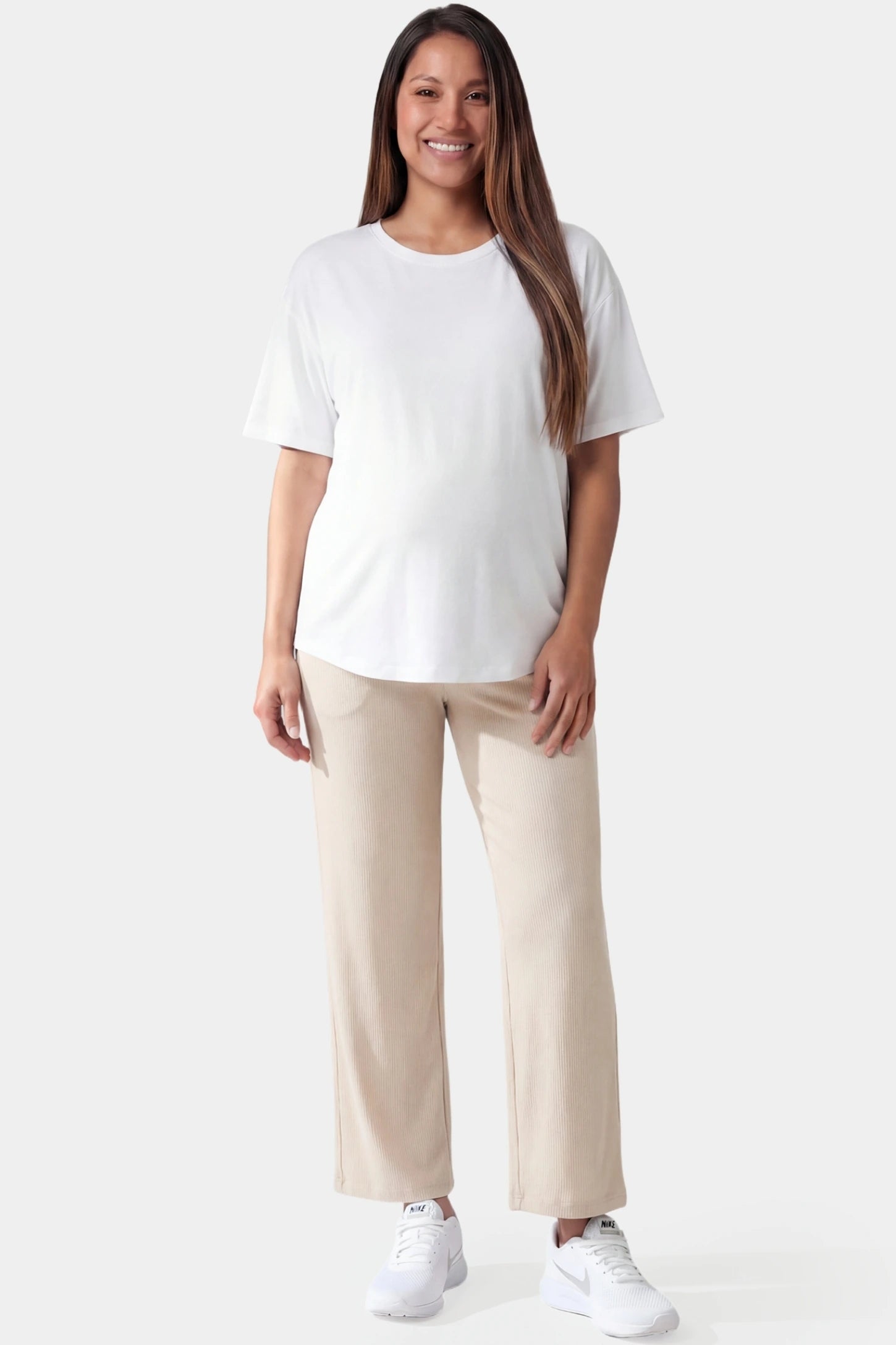 Adjustable Waistband High Waisted Wide-Leg Maternity Pants Adjustable waistband high waisted wide-leg maternity pants in beige featuring relaxed flowing silhouette in full body view on a pregnant model