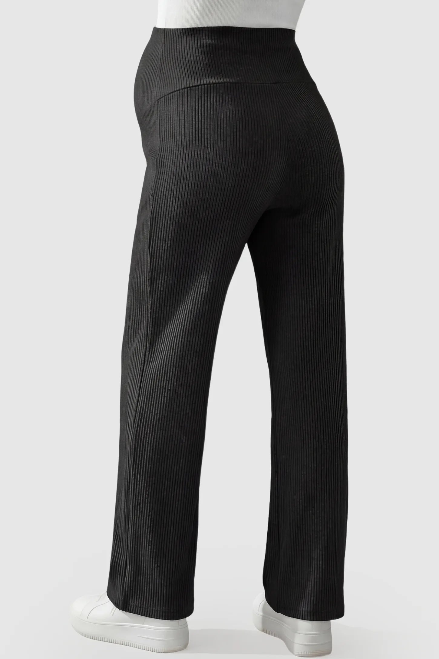 Adjustable Waistband High Waisted Wide-Leg Maternity Pants Adjustable waistband high waisted wide-leg maternity pants in black featuring comfortable high-rise fit in back view on a pregnant model