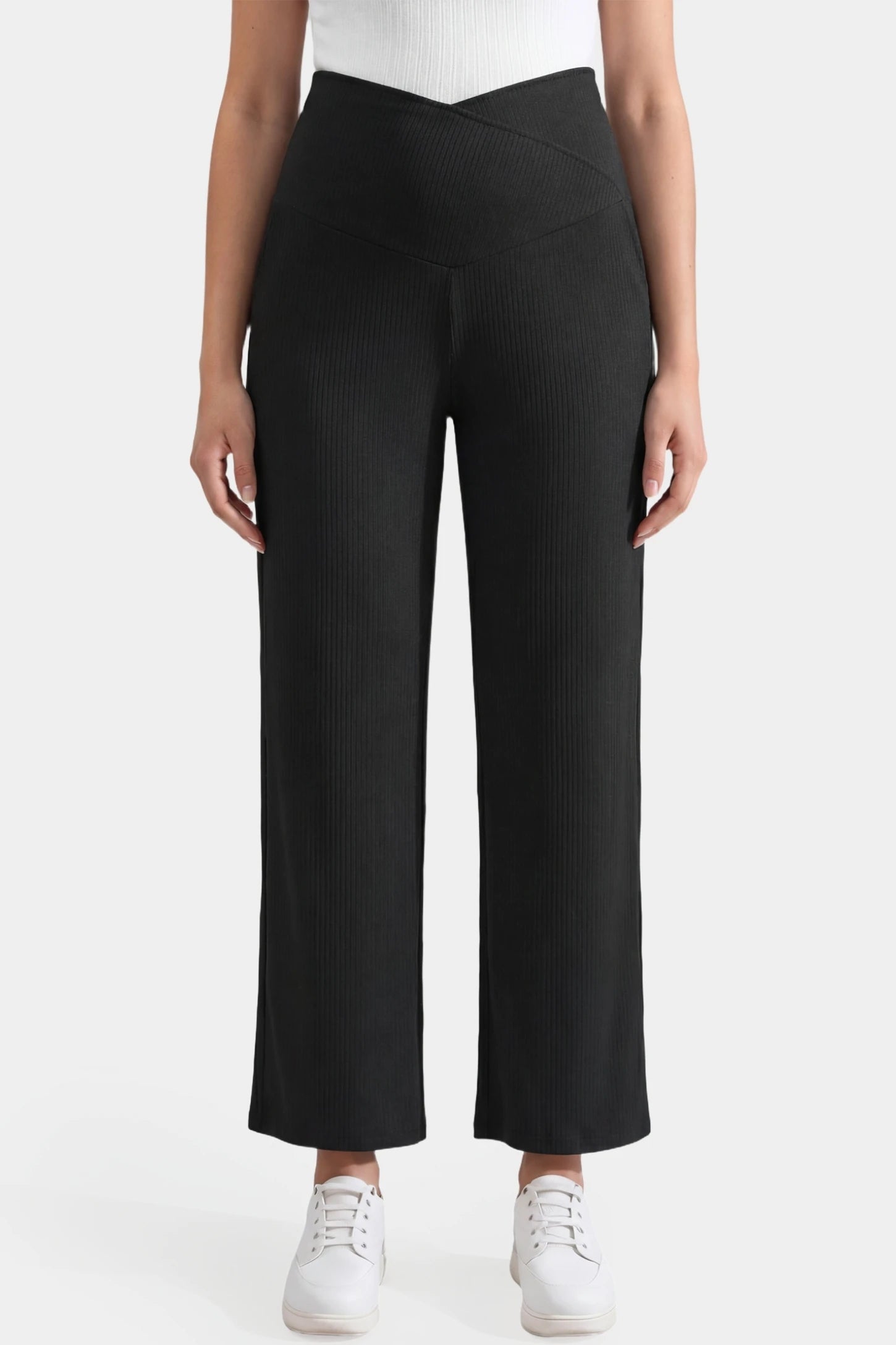 Adjustable waistband high waisted wide-leg maternity pants in black featuring a wide-leg silhouette in front view on a pregnant model