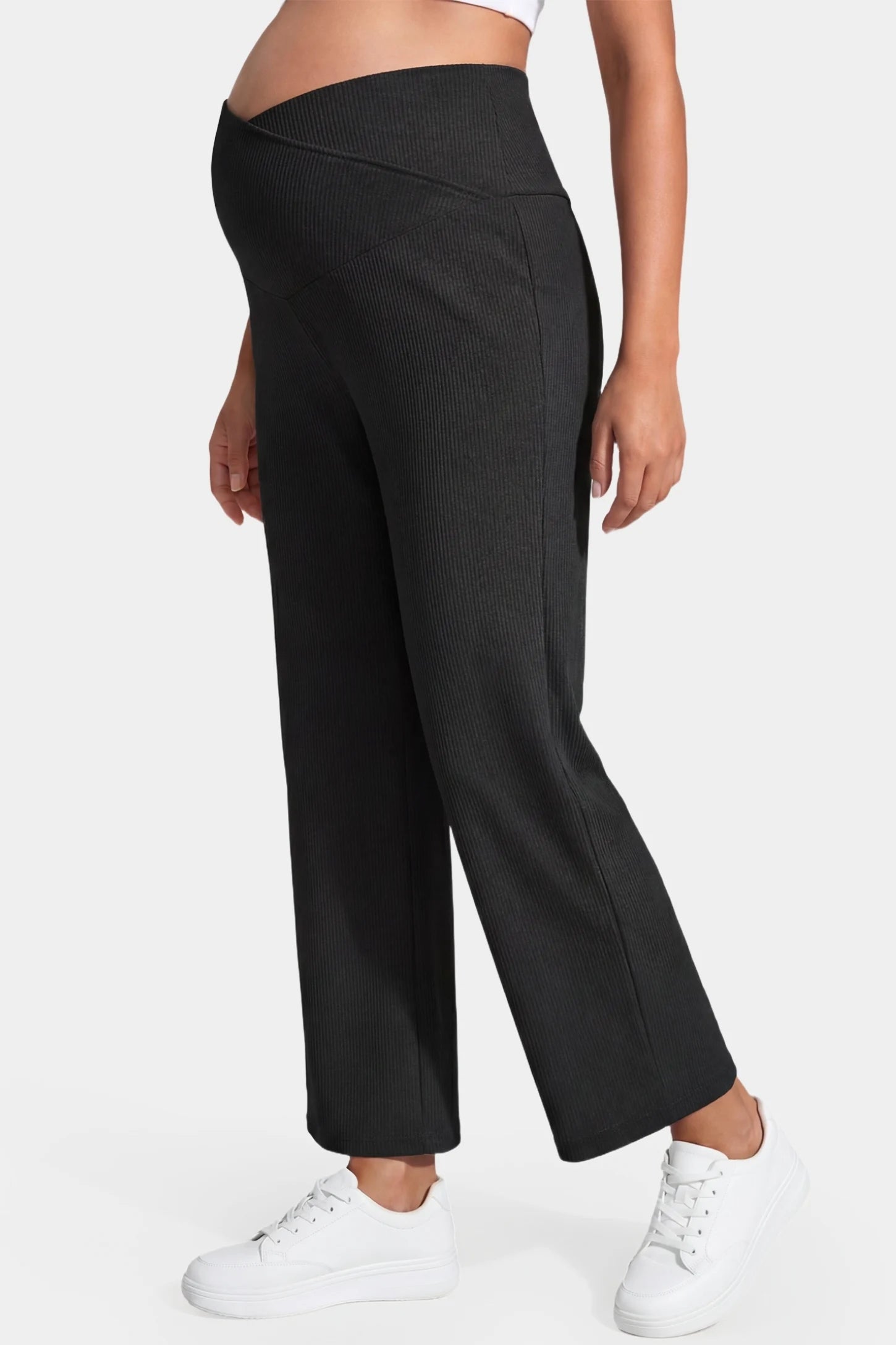 Adjustable Waistband High Waisted Wide-Leg Maternity Pants Adjustable waistband high waisted wide-leg maternity pants in black featuring stretchy polyester-spandex fabric in side view on a pregnant model