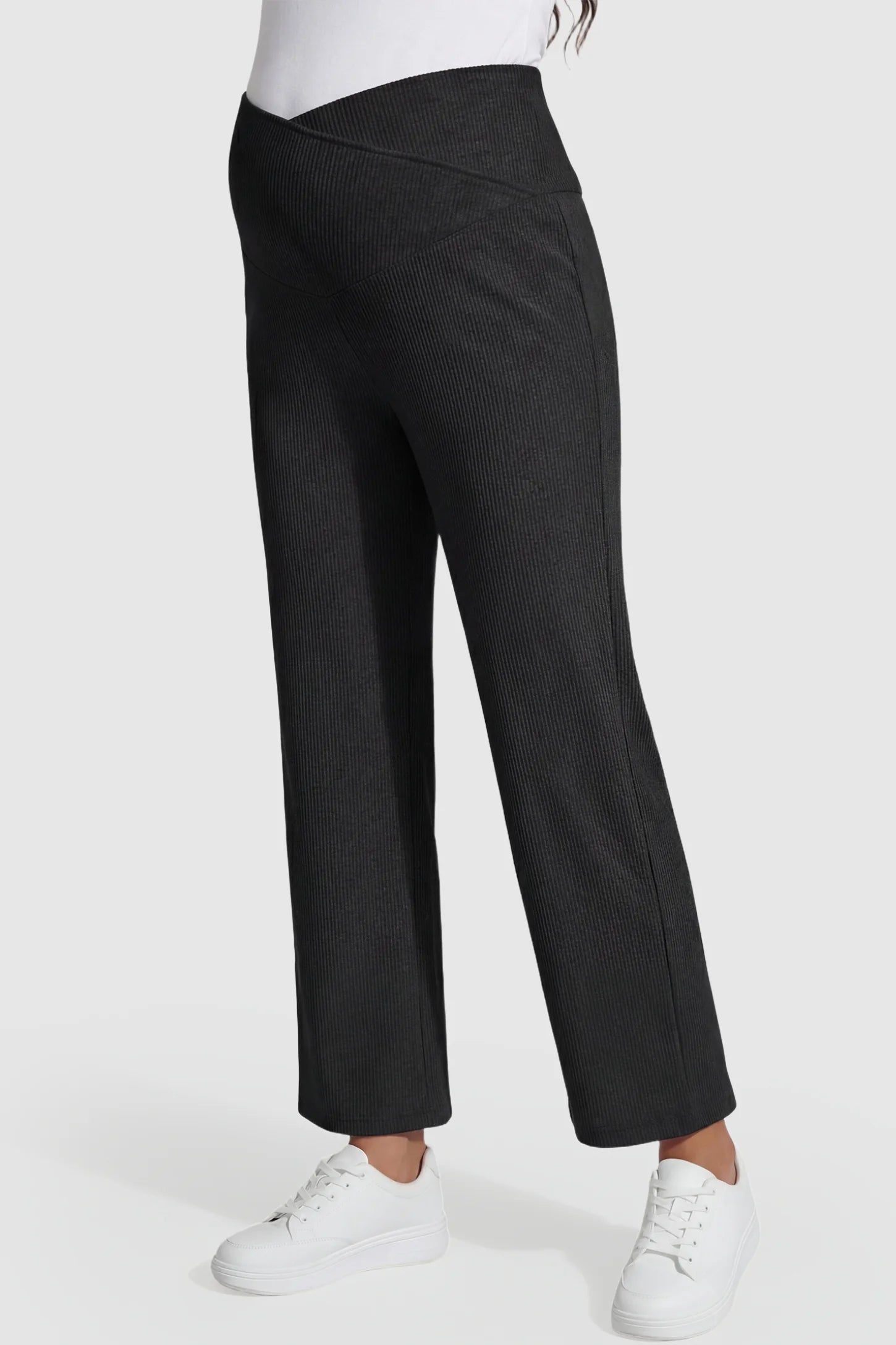Adjustable Waistband High Waisted Wide-Leg Maternity Pants Adjustable waistband high waisted wide-leg maternity pants in black featuring stretchy polyester-spandex fabric in side view on a pregnant model
