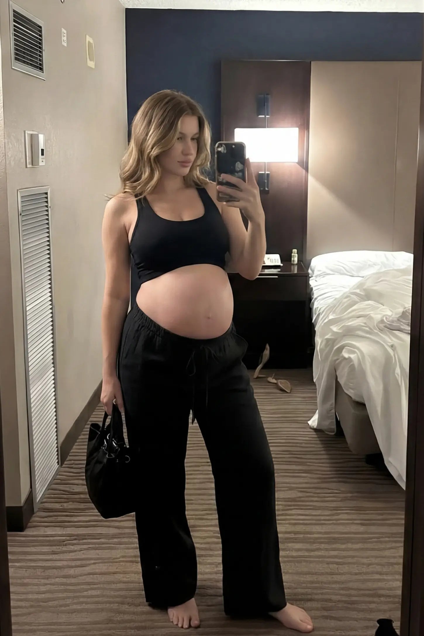 High-Waist Drawstring Wide-Leg Maternity Pants High-waist drawstring wide-leg maternity pants in black with loose silhouette, full body on UGC model