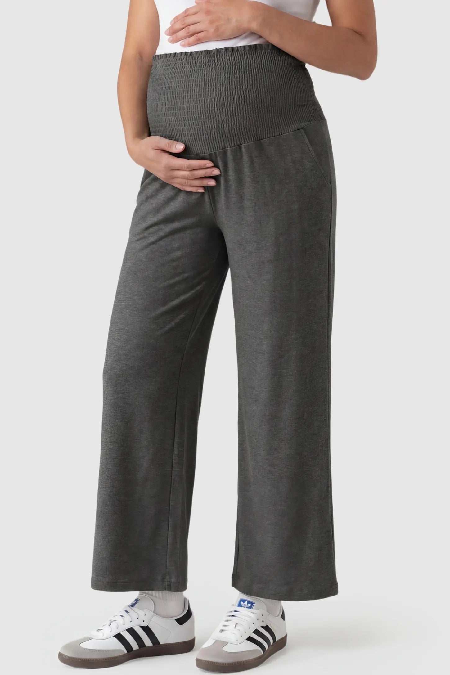 High-waist wide-leg maternity pants in charcoal gray with stretch waistband, front view on pregnant model