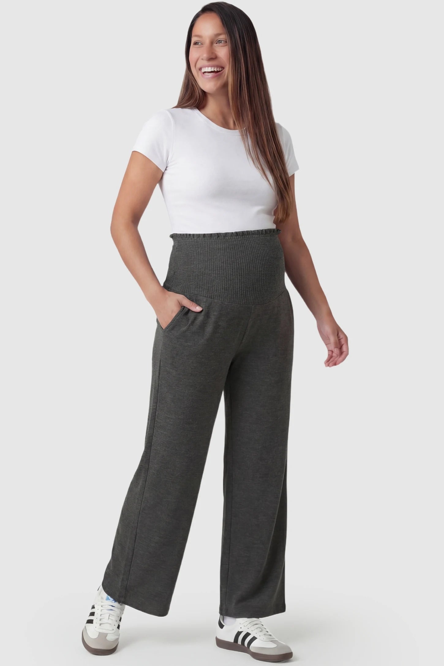 High-waist wide-leg maternity pants in charcoal gray with relaxed drape, full body on pregnant model