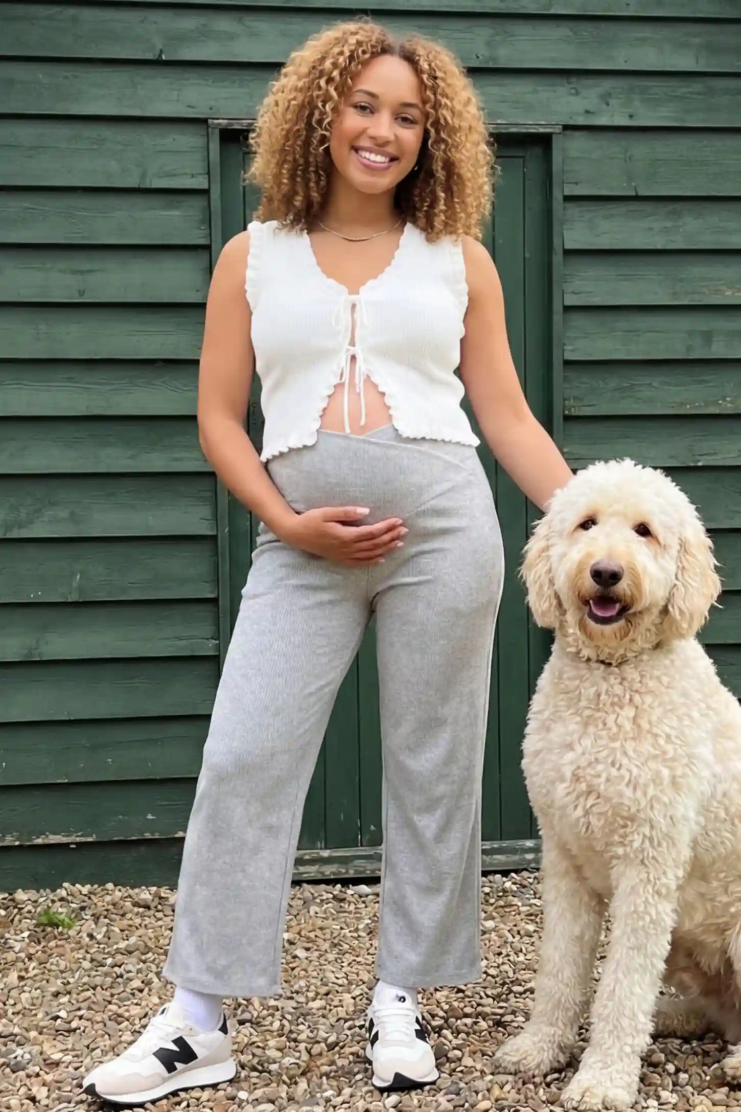 Adjustable Waistband High Waisted Wide-Leg Maternity Pants Adjustable waistband high waisted wide-leg maternity pants in gray featuring relaxed flowing silhouette in full body view on a editorial lifestyle model