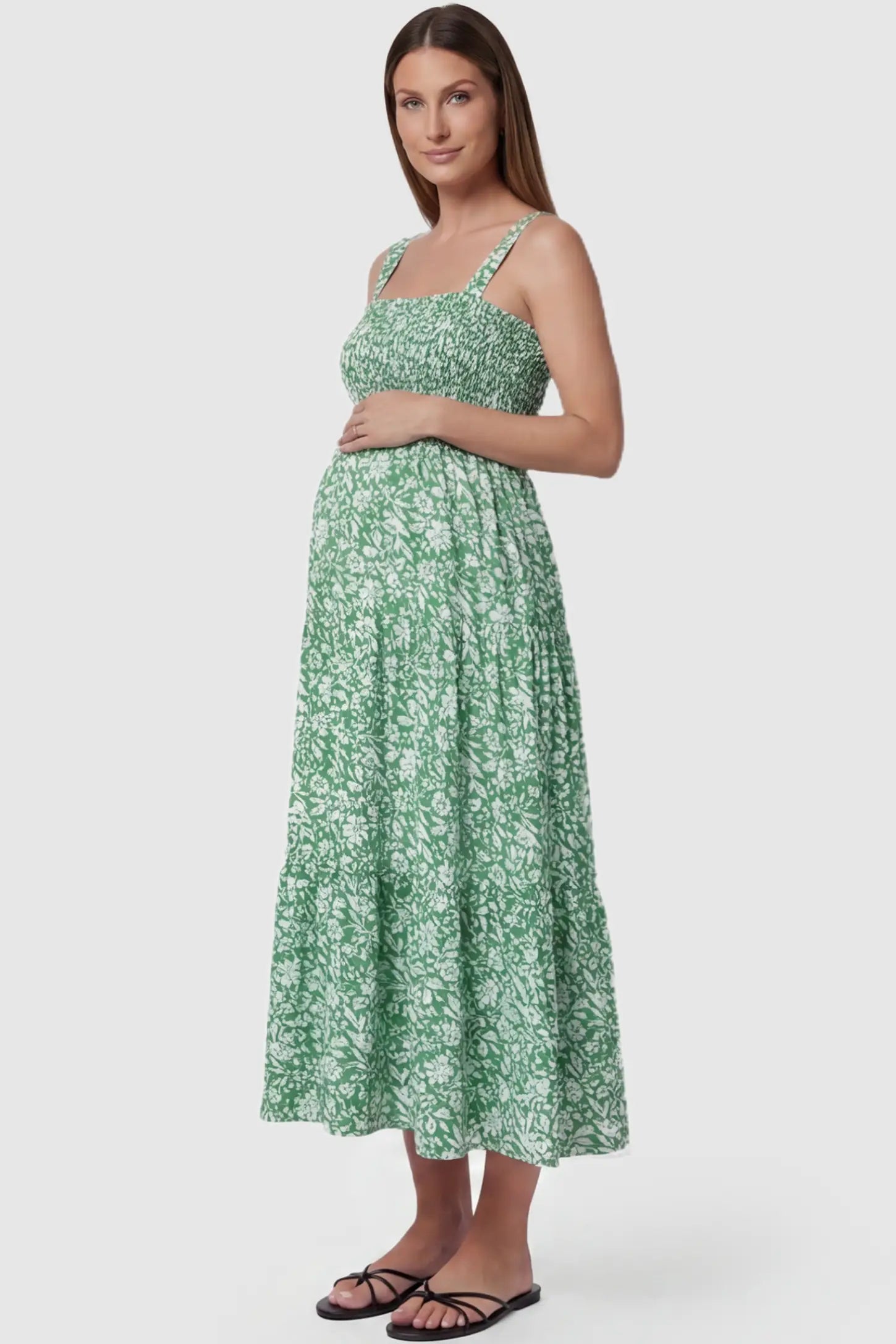 Floral Print Square Neck Tiered Maternity Sundress Floral Print Square Neck Tiered Maternity Sundress in green featuring smocked bodice and wide straps on pregnant model side view