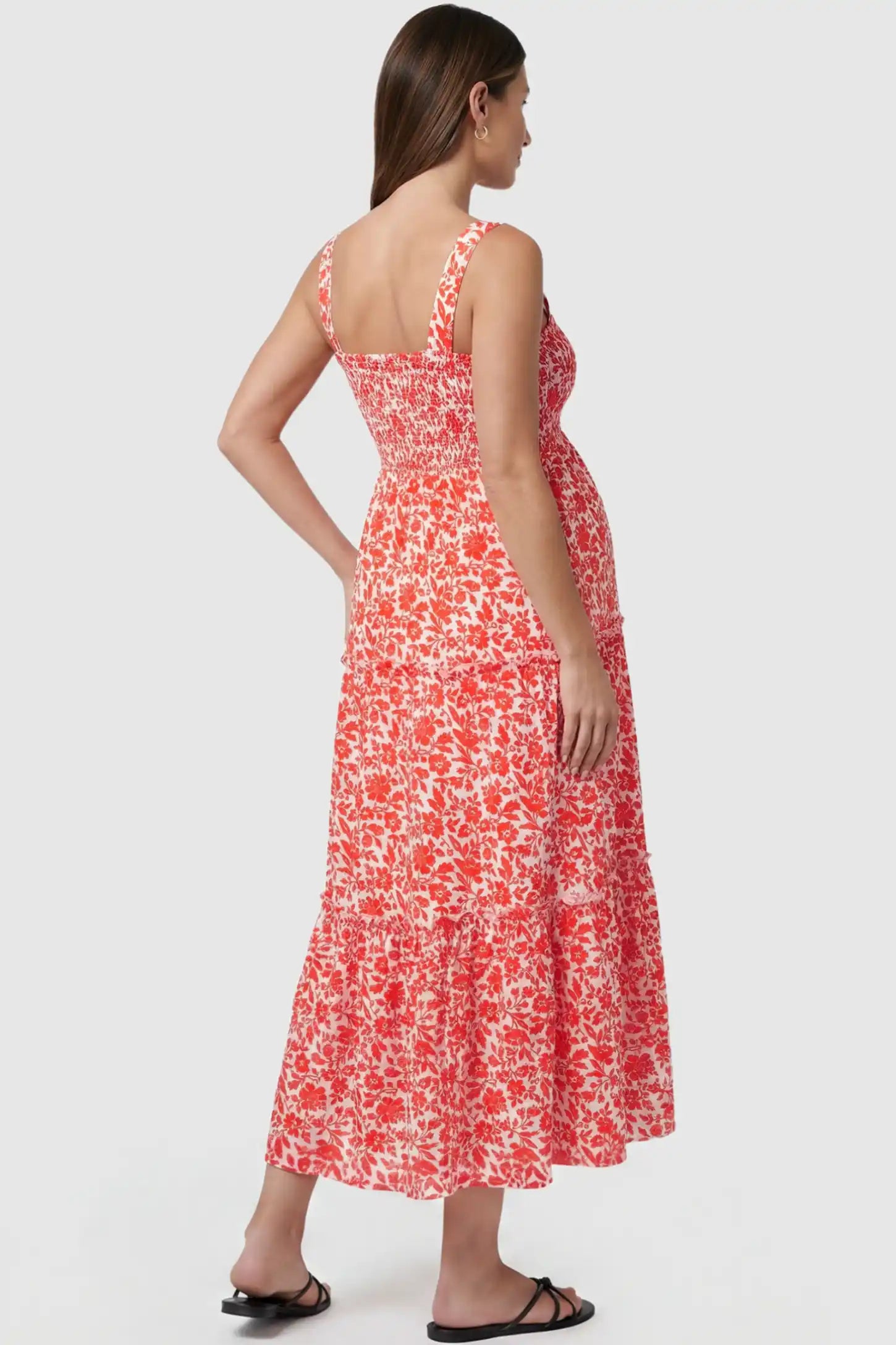 Floral Print Square Neck Tiered Maternity Sundress Floral Print Square Neck Tiered Maternity Sundress in orange featuring smocked bodice and wide straps on pregnant model back view