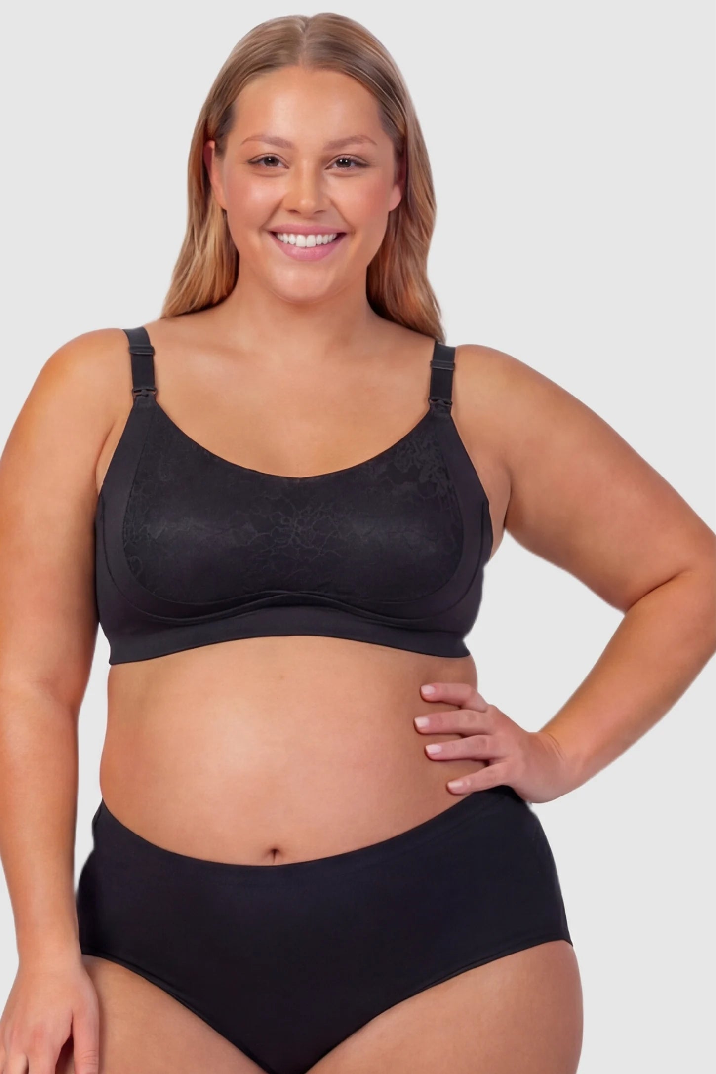 Wireless Front-Open Scalloped Lace Maternity Nursing Bra Wireless Front-Open Scalloped Lace Maternity Nursing Bra in Black featuring a front-open nursing structure on a front angle view of a plus size pregnant model.