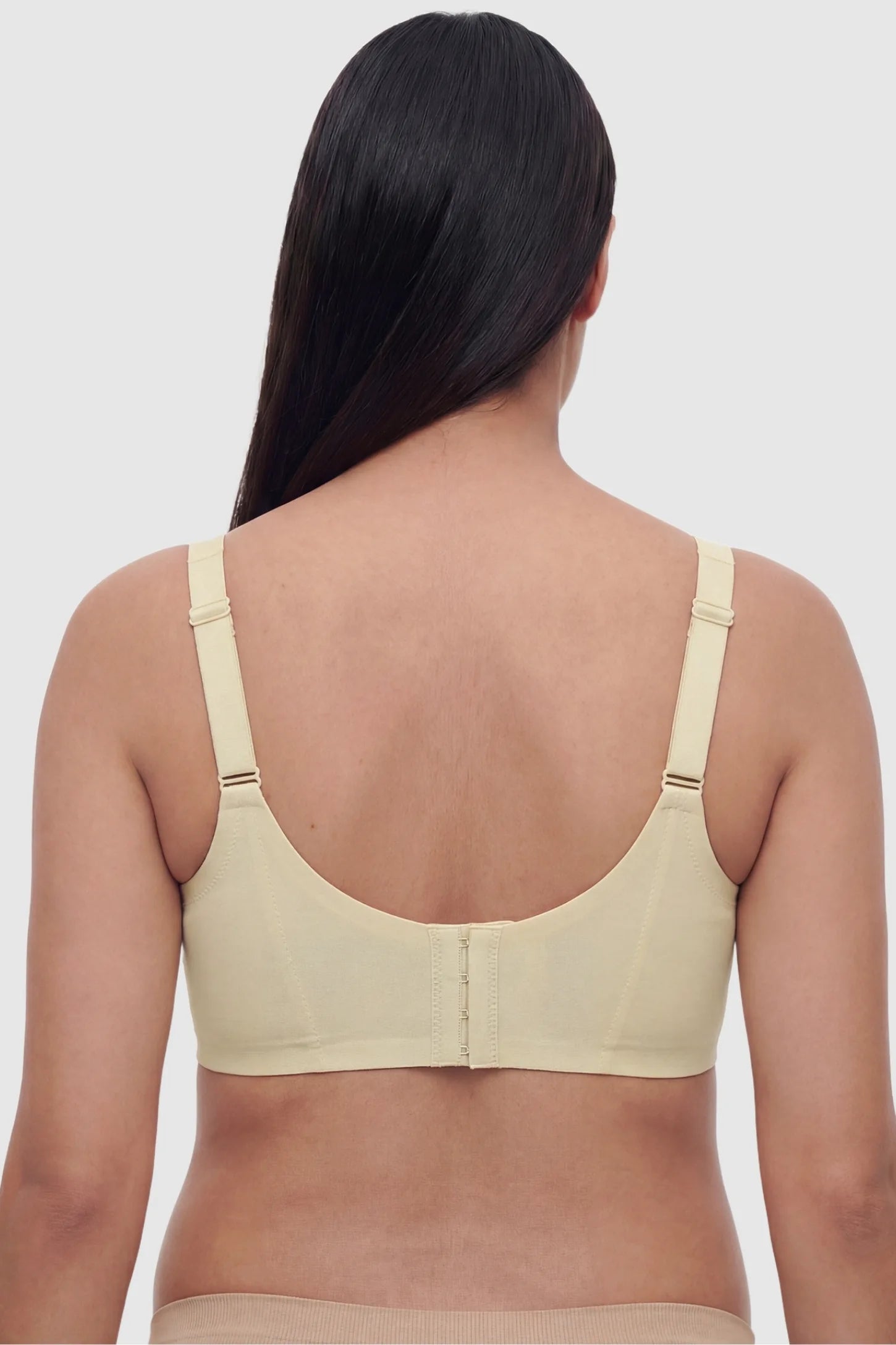 Wireless Front-Open Scalloped Lace Maternity Nursing Bra Wireless Front-Open Scalloped Lace Maternity Nursing Bra in Skin featuring a 3-row hook back view on a back angle view of a model.