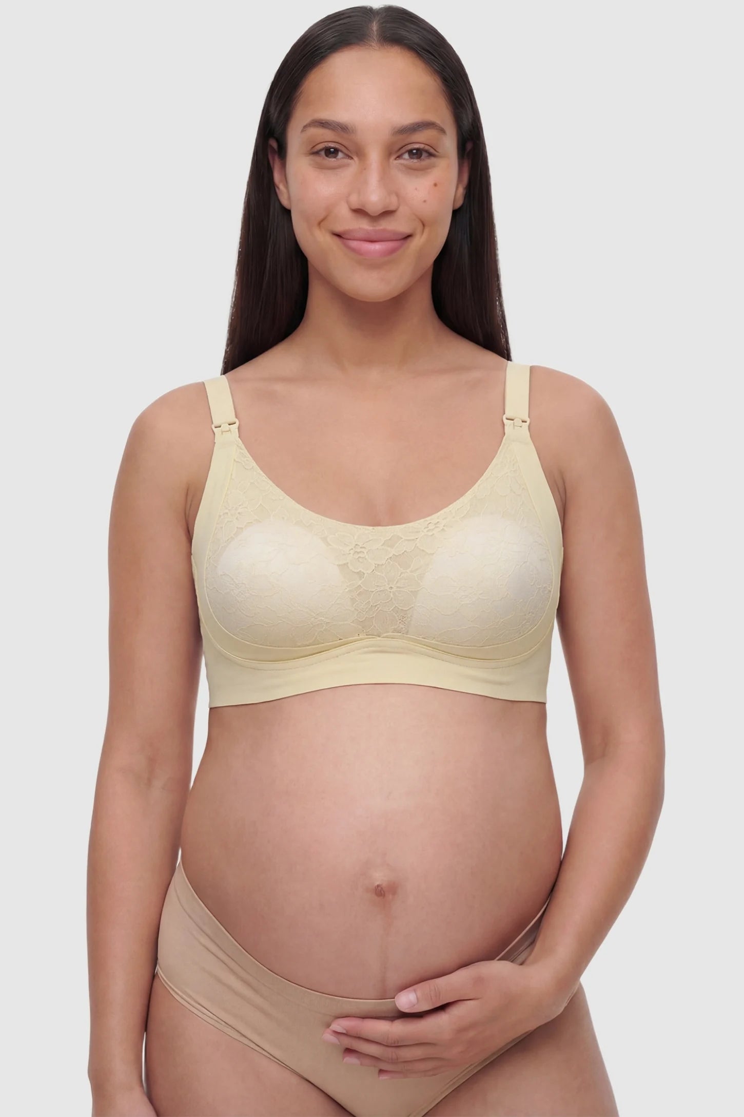 Wireless Front-Open Scalloped Lace Maternity Nursing Bra Wireless Front-Open Scalloped Lace Maternity Nursing Bra in Skin featuring a front-open nursing structure on a front angle view of a pregnant model.