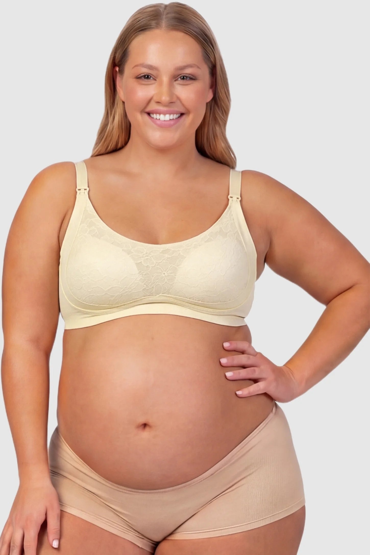 Wireless Front-Open Scalloped Lace Maternity Nursing Bra Wireless Front-Open Scalloped Lace Maternity Nursing Bra in Skin featuring a front-open nursing structure on a front angle view of a plus size pregnant model.
