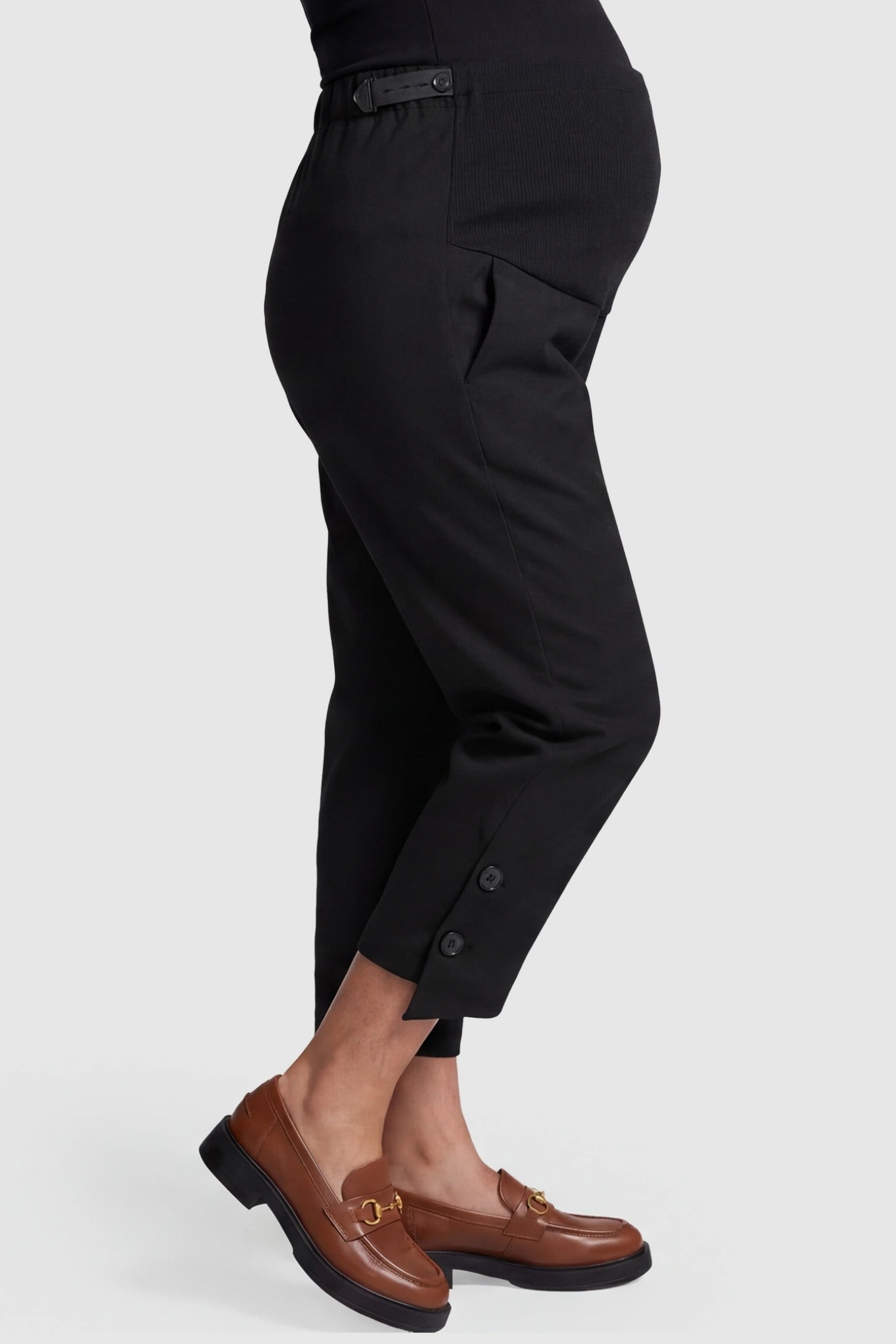 Woolen Blend Adjustable Cropped Wide Leg Maternity Slacks Side view of Black Woolen Blend Adjustable Cropped Wide Leg Maternity Slacks showing the adjustable waist tab.