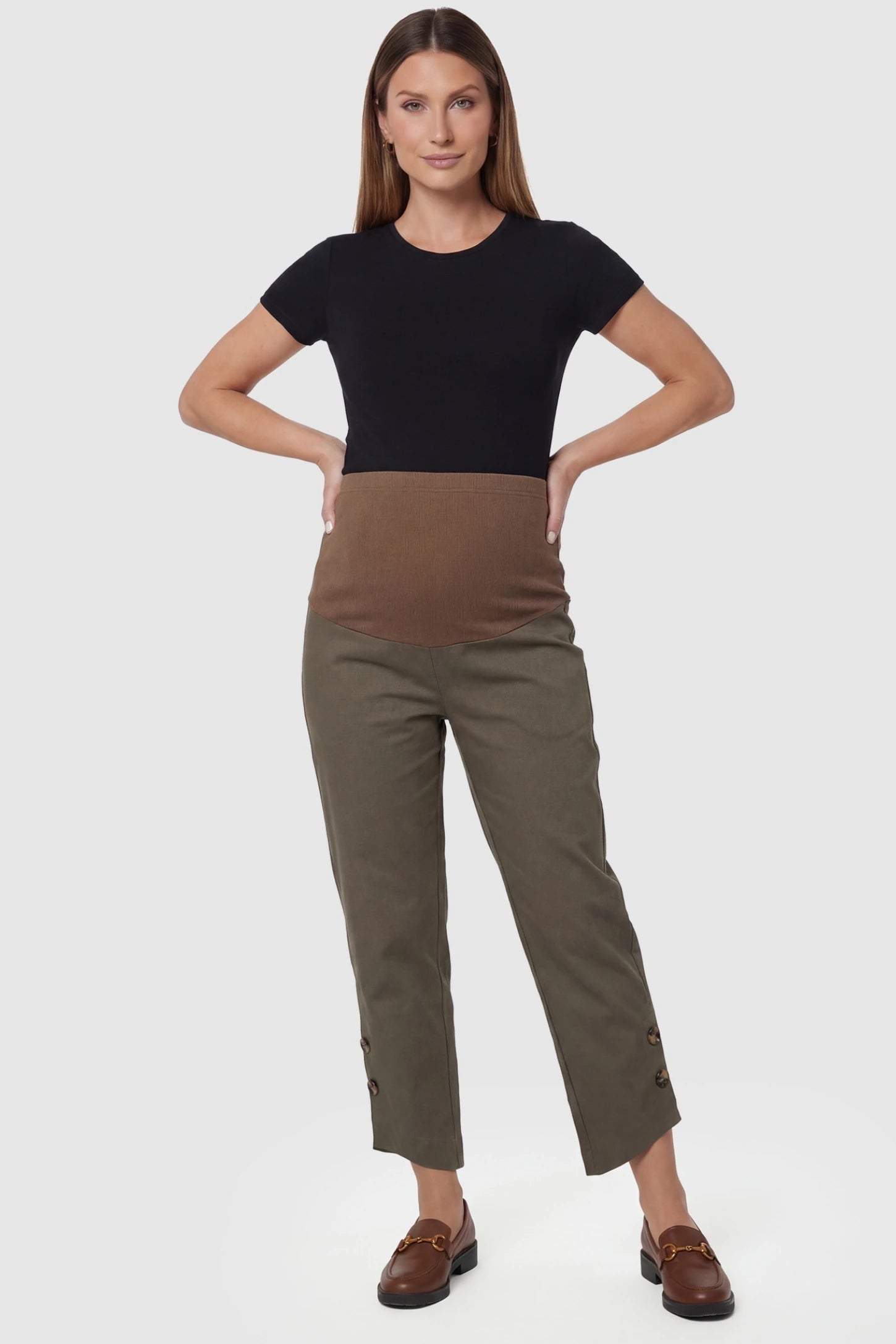 Woolen Blend Adjustable Cropped Wide Leg Maternity Slacks Coffee Woolen Blend Adjustable Cropped Wide Leg Maternity Slacks featuring button-cuff detailing on a pregnant model in full body image.