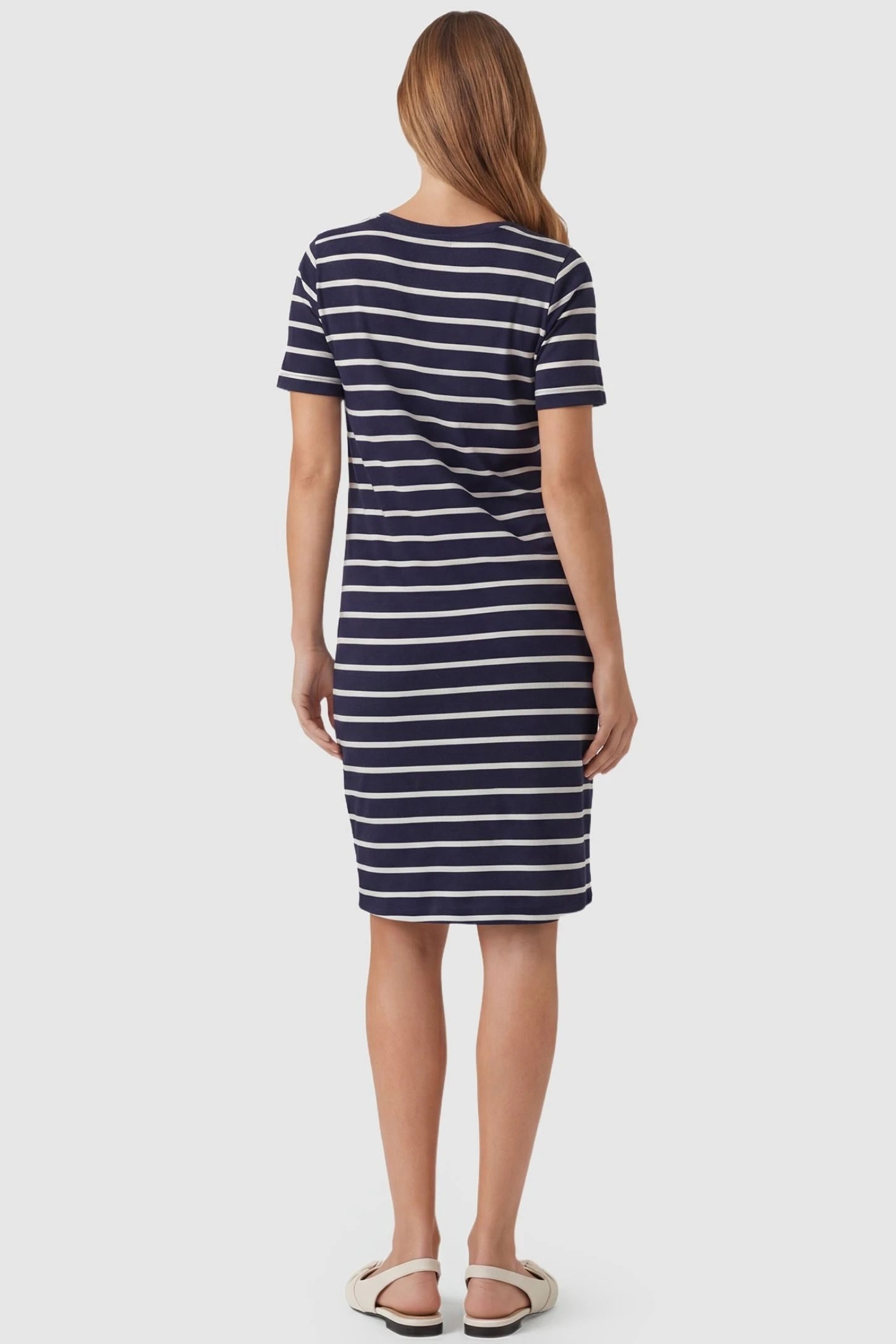 Short Sleeve Faux Wrap Maternity & Nursing Midi Dress Short Sleeve Faux Wrap Maternity & Nursing Midi Dress in navy striped print featuring short sleeves on a pregnant model back view.