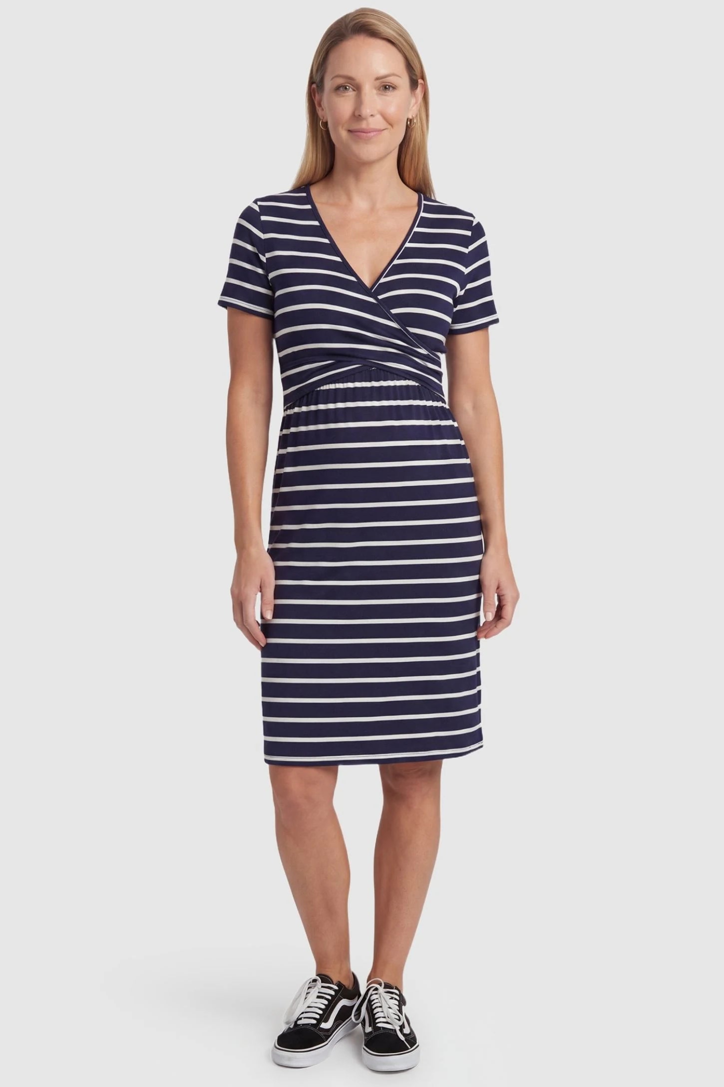 Short Sleeve Faux Wrap Maternity & Nursing Midi Dress Short Sleeve Faux Wrap Maternity & Nursing Midi Dress in navy striped print featuring V-neck faux wrap bodice and empire waist on a non pregnant model front view.