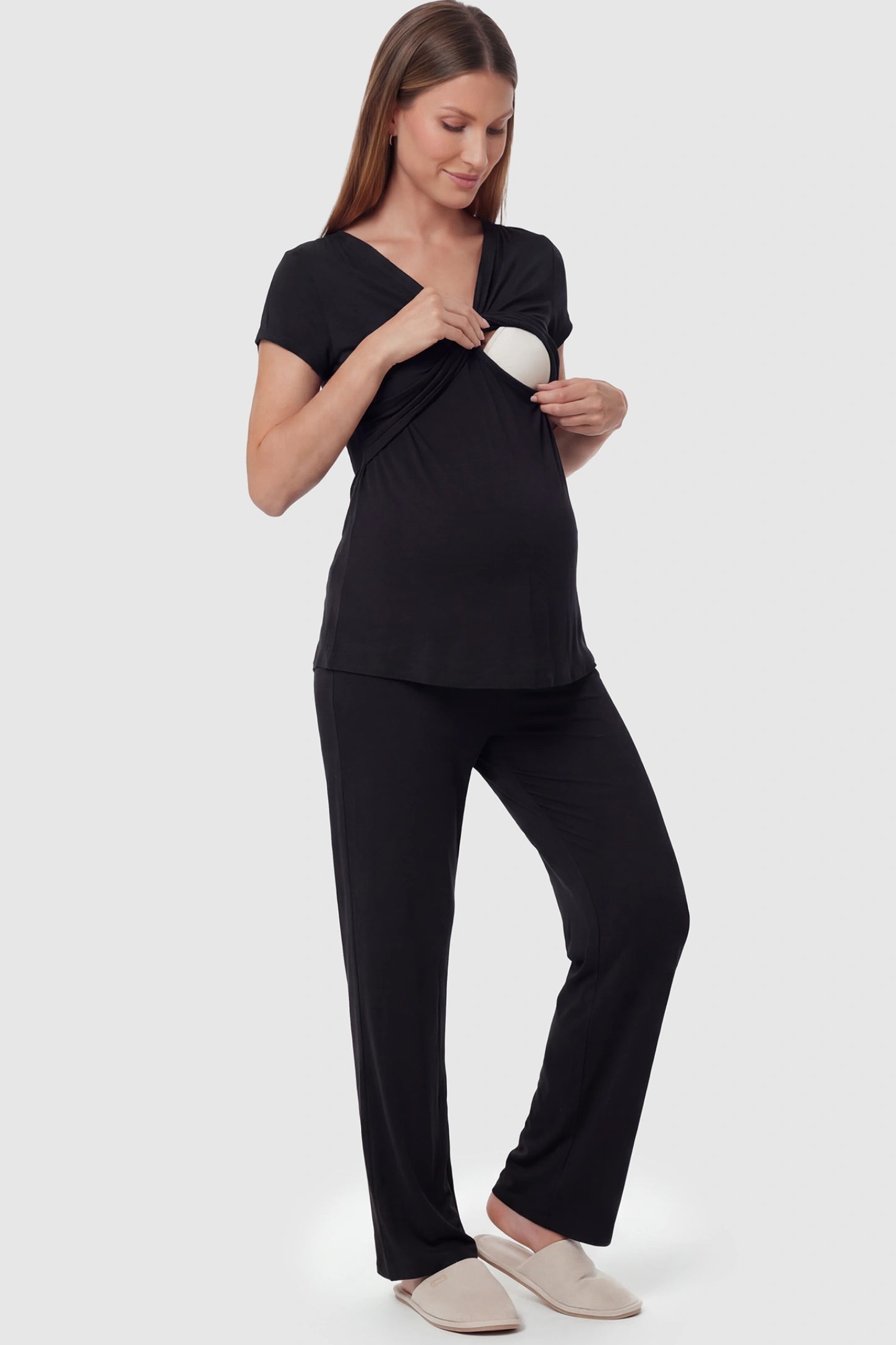 Wrap-Front Wide-Leg Maternity & Nursing Pajama Set Wrap-Front Wide-Leg Maternity & Nursing Pajama Set in black featuring nursing access and flowy wide-leg pants on pregnant model.