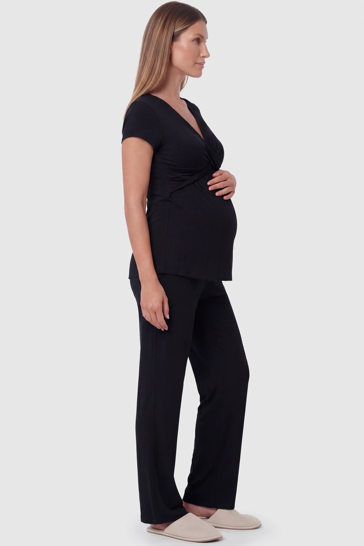 Wrap-Front Wide-Leg Maternity & Nursing Pajama Set in black featuring V-neck crossover top and flowy wide-leg pants on pregnant model.