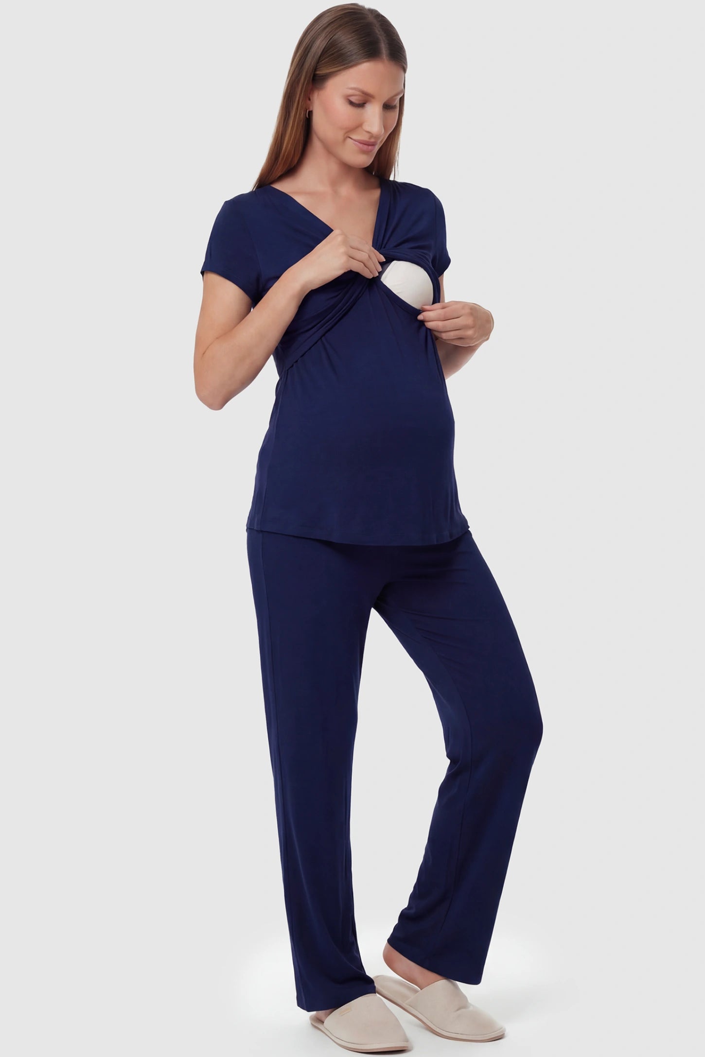 Wrap-Front Wide-Leg Maternity & Nursing Pajama Set Wrap-Front Wide-Leg Maternity & Nursing Pajama Set in navy blue featuring nursing access  top and flowy wide-leg pants on pregnant model.