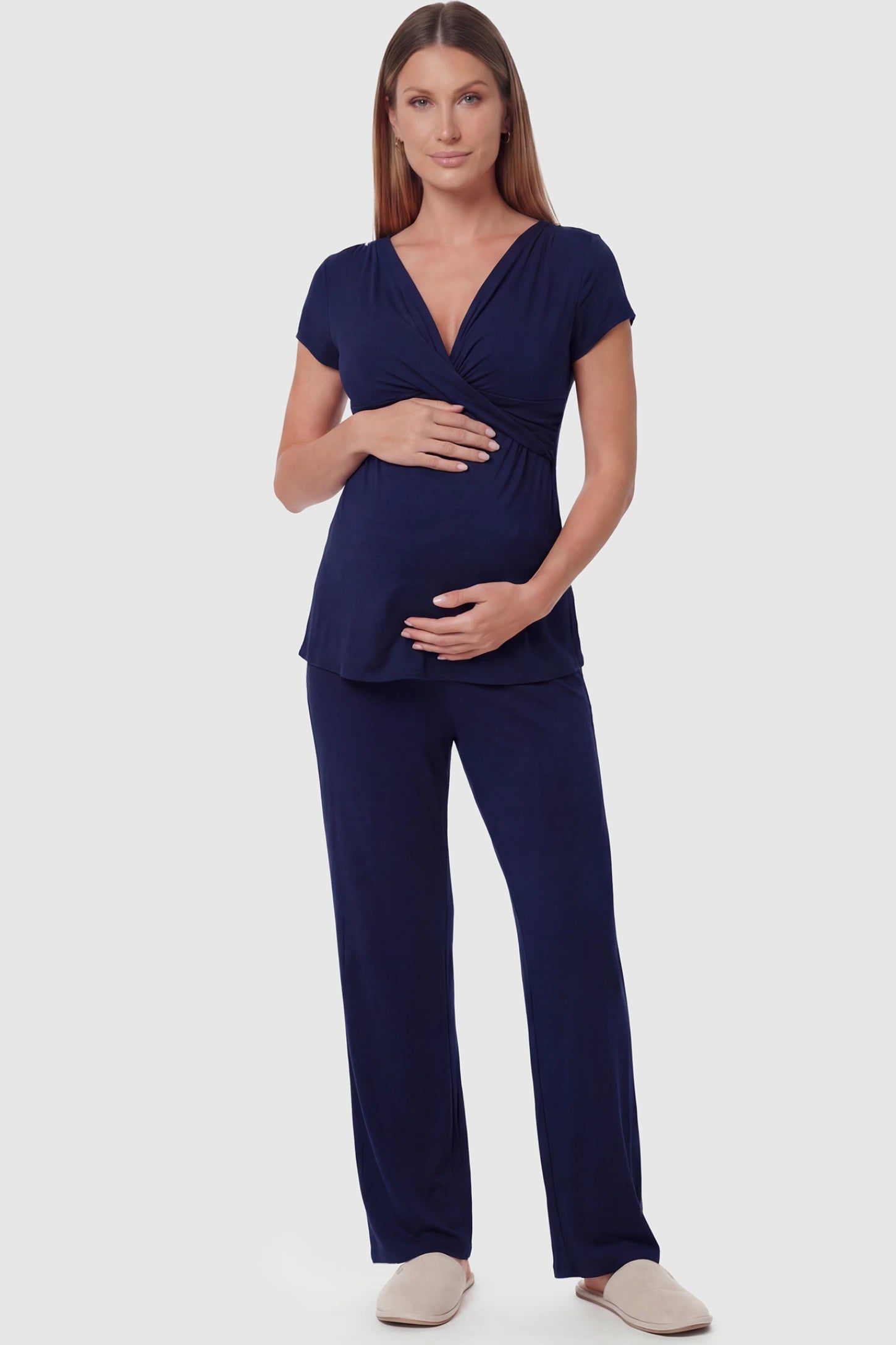 Wrap-Front Wide-Leg Maternity & Nursing Pajama Set Wrap-Front Wide-Leg Maternity & Nursing Pajama Set in navy blue featuring V-neck crossover top and flowy wide-leg pants on pregnant model.