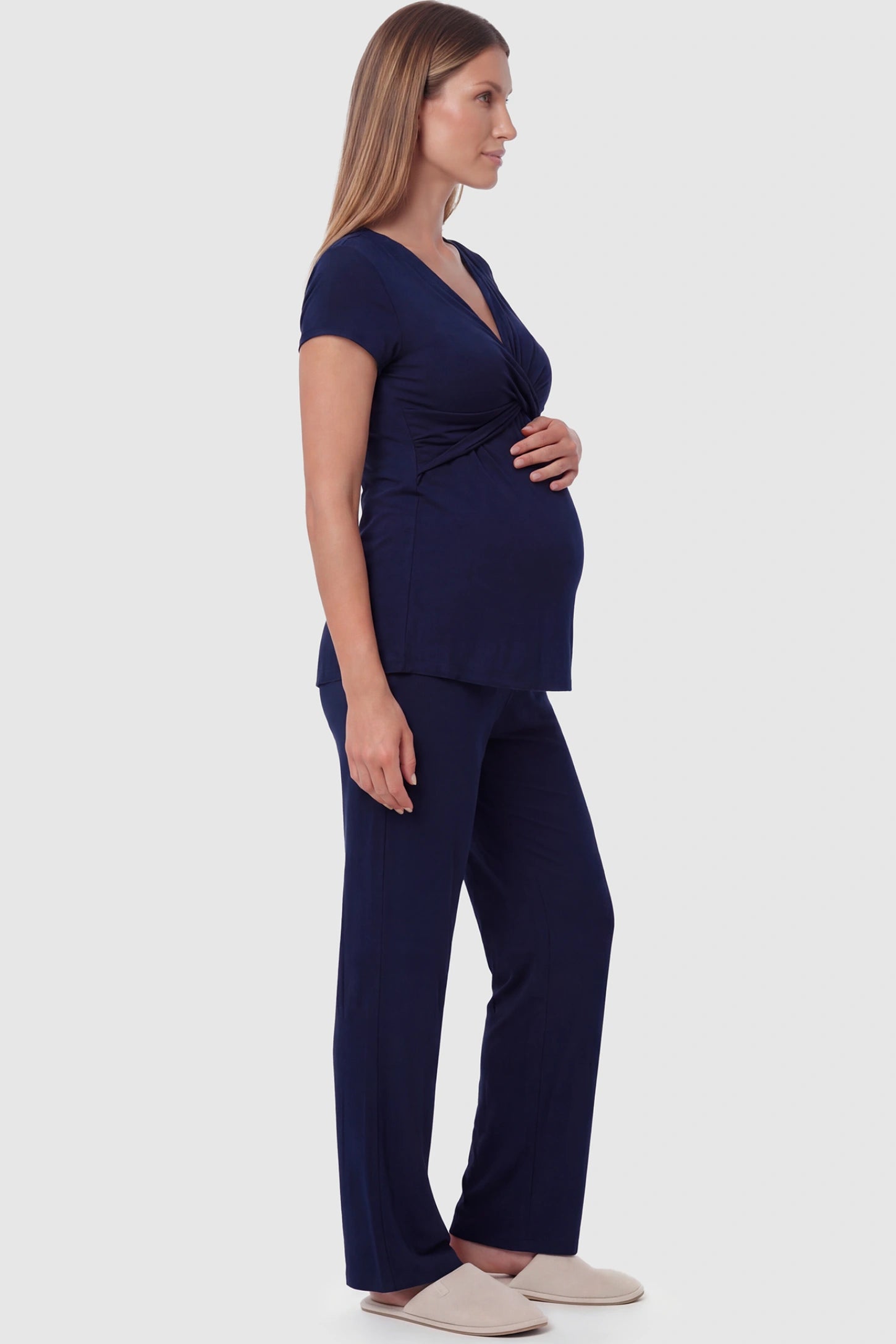 Wrap-Front Wide-Leg Maternity & Nursing Pajama Set Wrap-Front Wide-Leg Maternity & Nursing Pajama Set in navy blue featuring V-neck crossover top and flowy wide-leg pants on pregnant model.