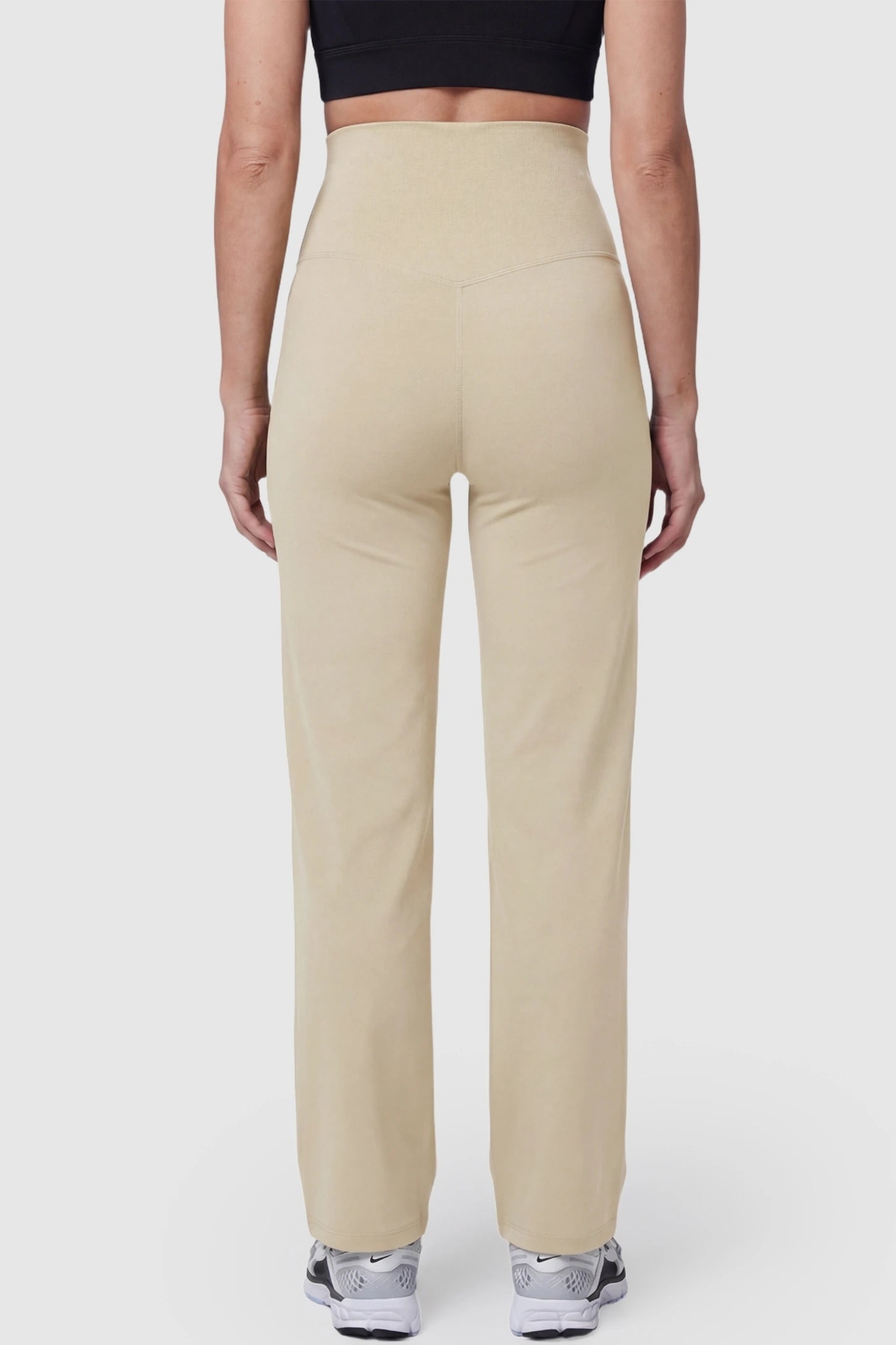 Suede-Finish High-Waisted Straight Leg Yoga Maternity Pants Suede-finish high-waisted straight leg yoga maternity pants in beige with straight-leg cut, back view on pregnant model