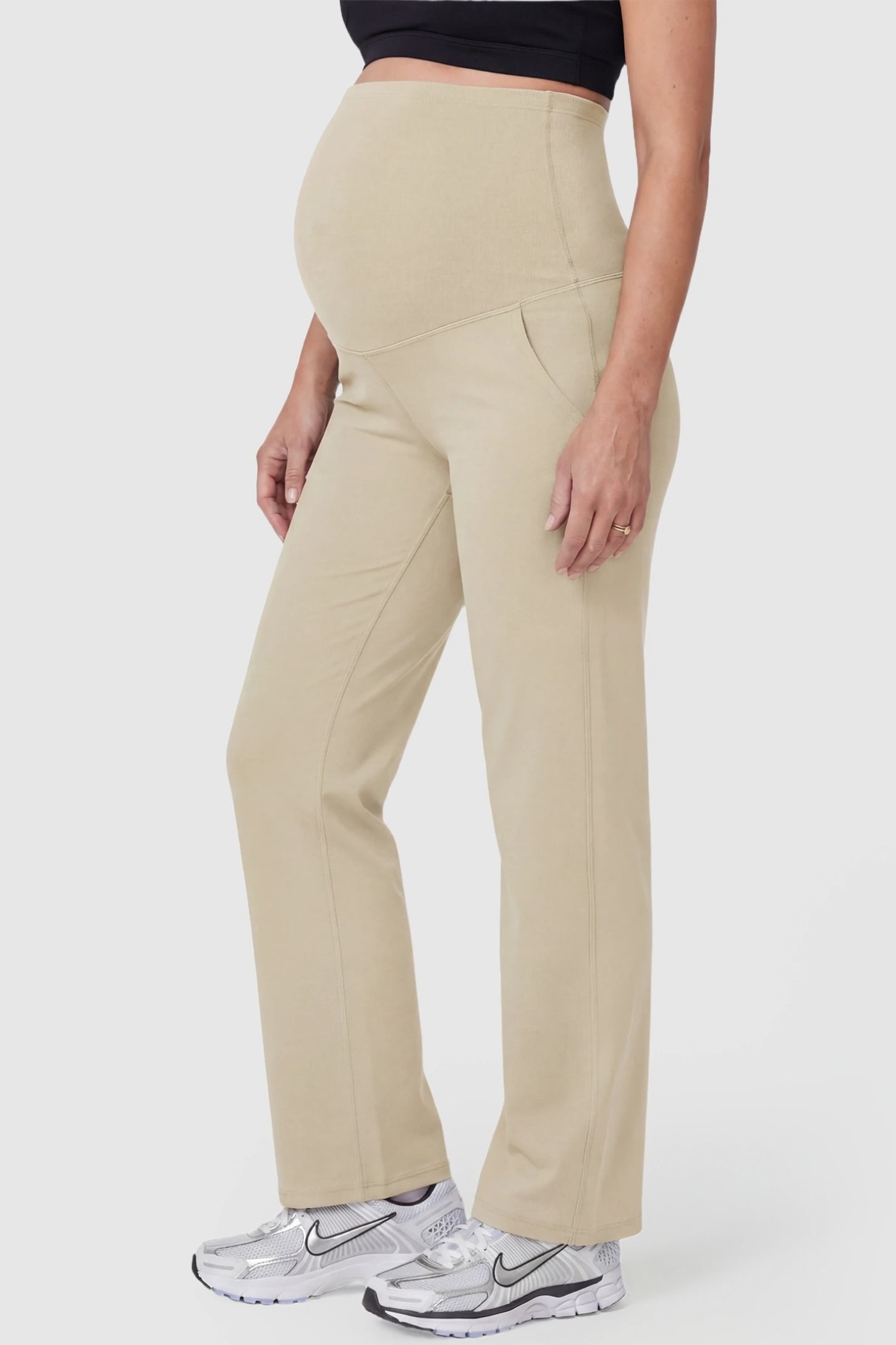 Suede-Finish High-Waisted Straight Leg Yoga Maternity Pants Suede-finish high-waisted straight leg yoga maternity pants in beige with zippered pockets, side view on pregnant model