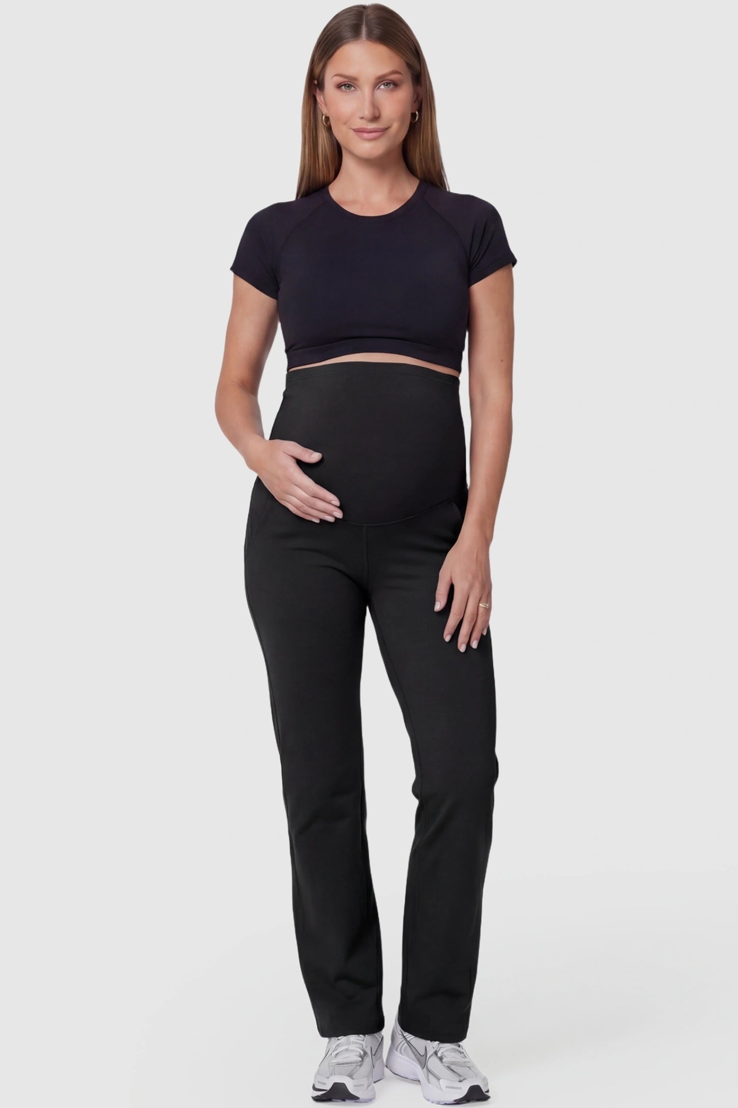Suede-Finish High-Waisted Straight Leg Yoga Maternity Pants Suede-finish high-waisted straight leg yoga maternity pants in black with straight leg cut, full body on pregnant model