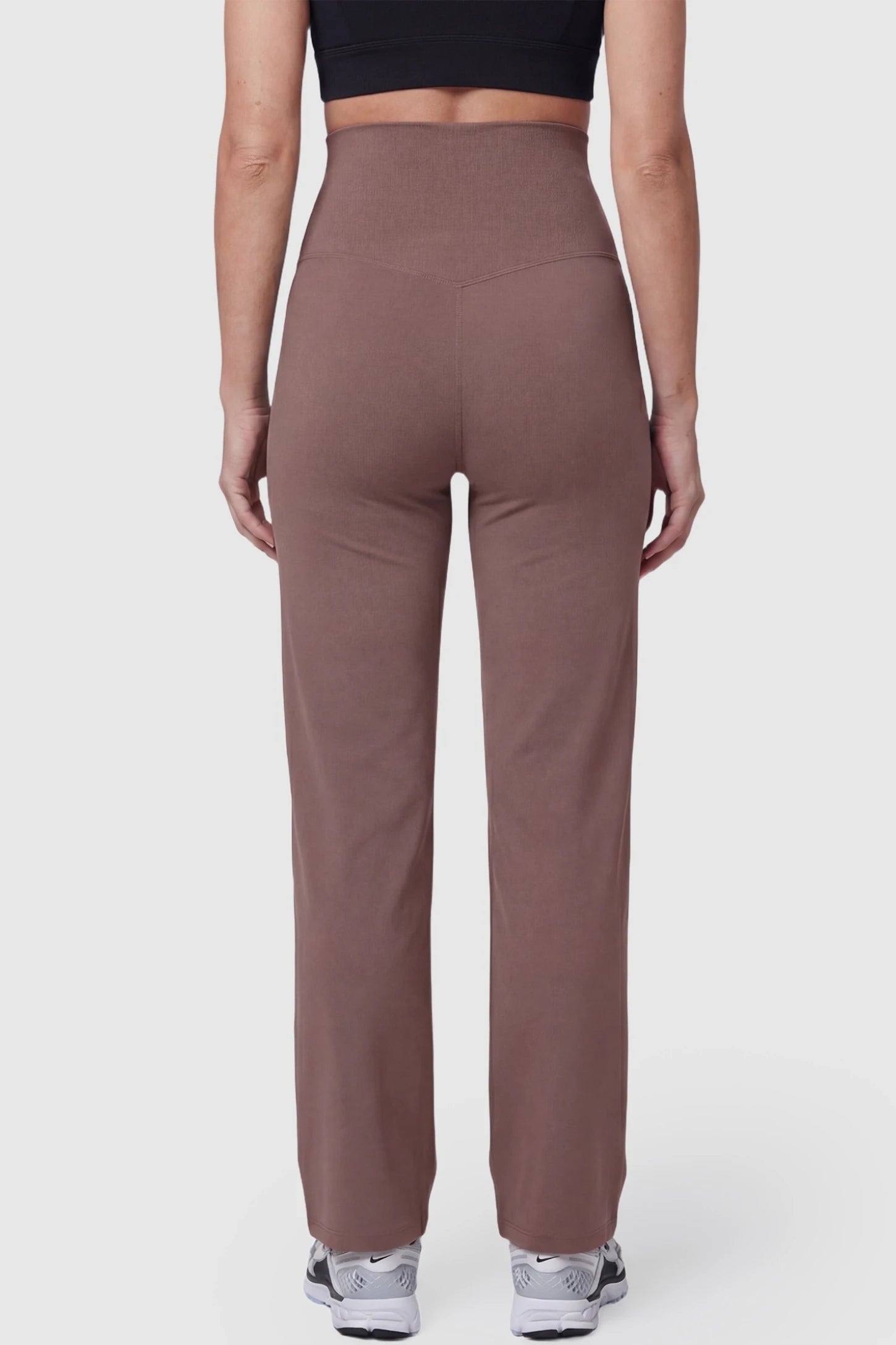 Suede-Finish High-Waisted Straight Leg Yoga Maternity Pants Suede-finish high-waisted straight leg yoga maternity pants in brown with straight-leg cut, back view on pregnant model