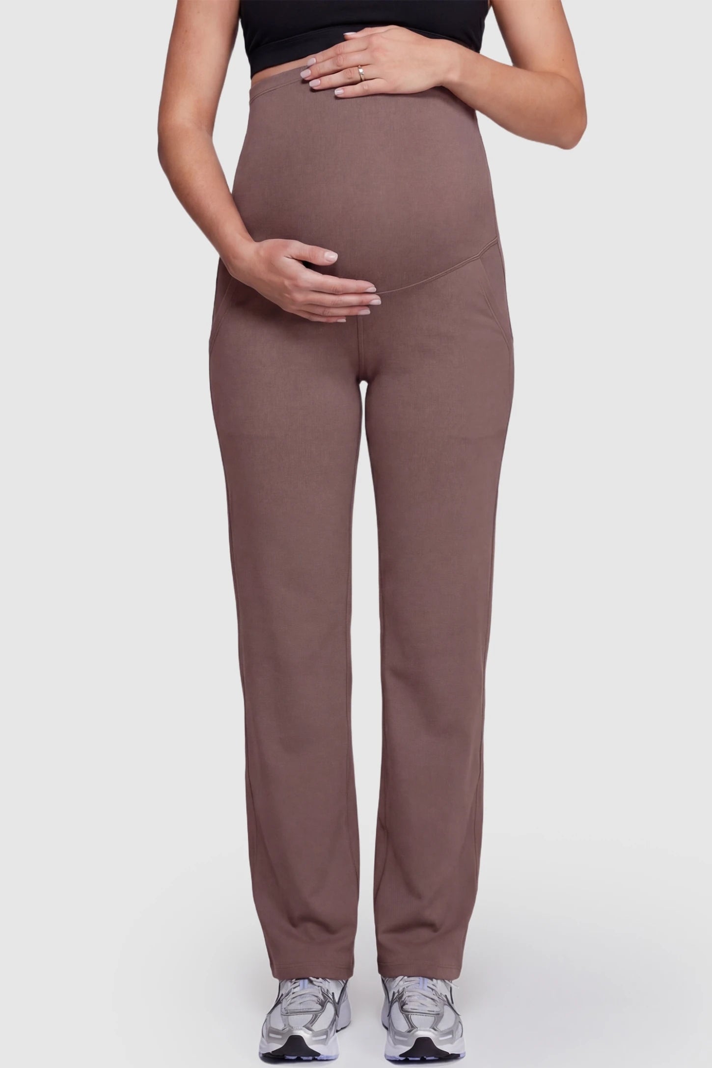 Suede-Finish High-Waisted Straight Leg Yoga Maternity Pants Suede-finish high-waisted straight leg yoga maternity pants in brown with belly support band, front view on pregnant model