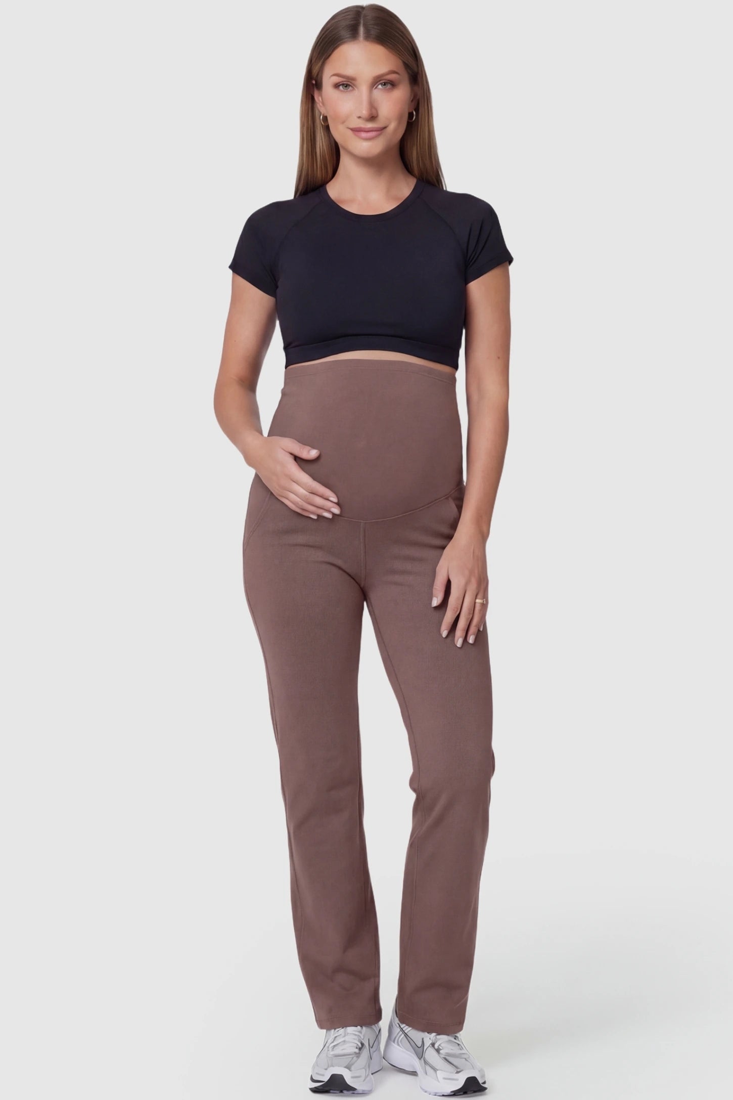 Suede-Finish High-Waisted Straight Leg Yoga Maternity Pants Suede-finish high-waisted straight leg yoga maternity pants in brown with straight leg cut, full body on pregnant model
