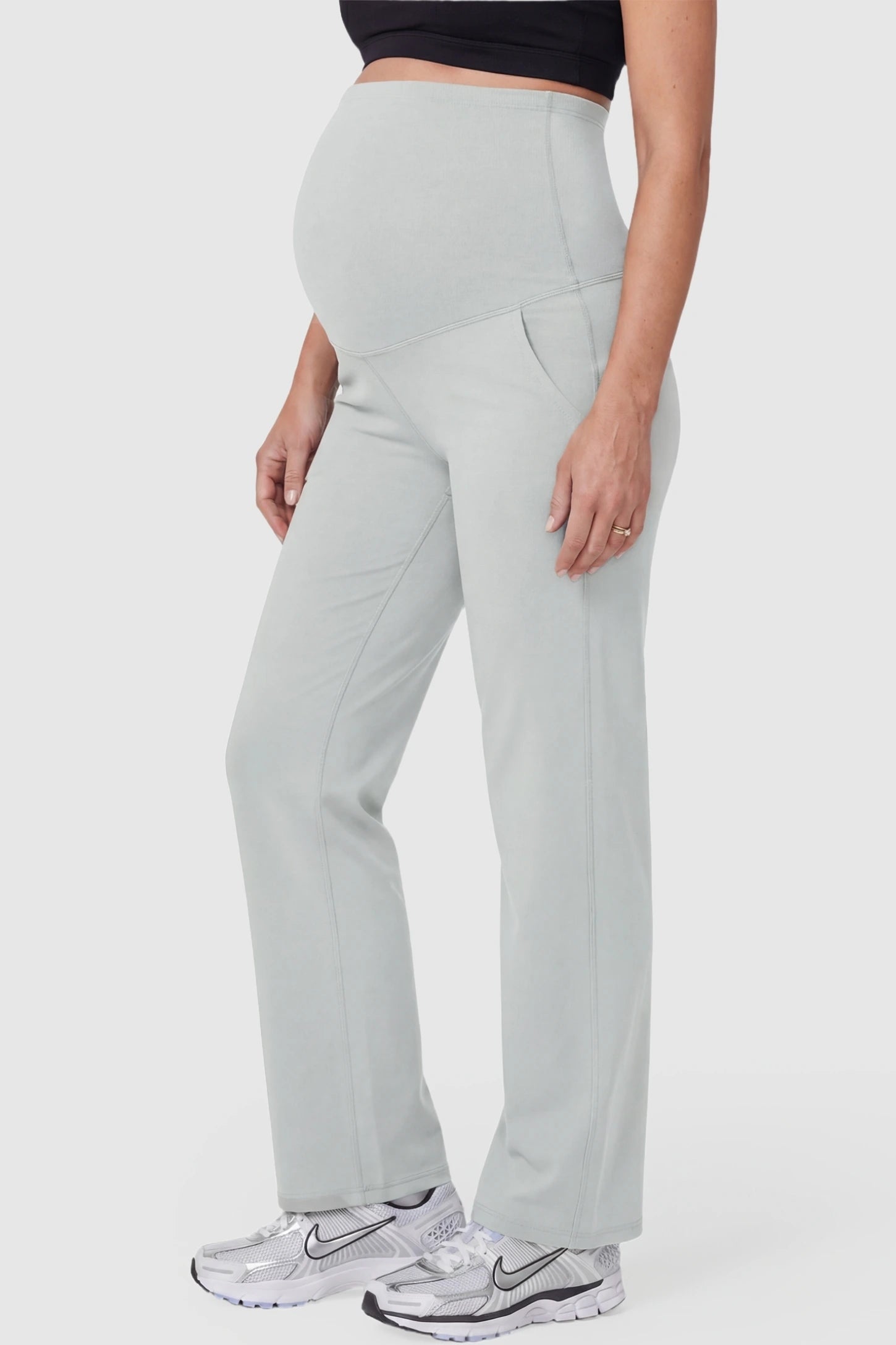 Suede-Finish High-Waisted Straight Leg Yoga Maternity Pants Suede-finish high-waisted straight leg yoga maternity pants in granny-gray with zippered pockets, side view on pregnant model