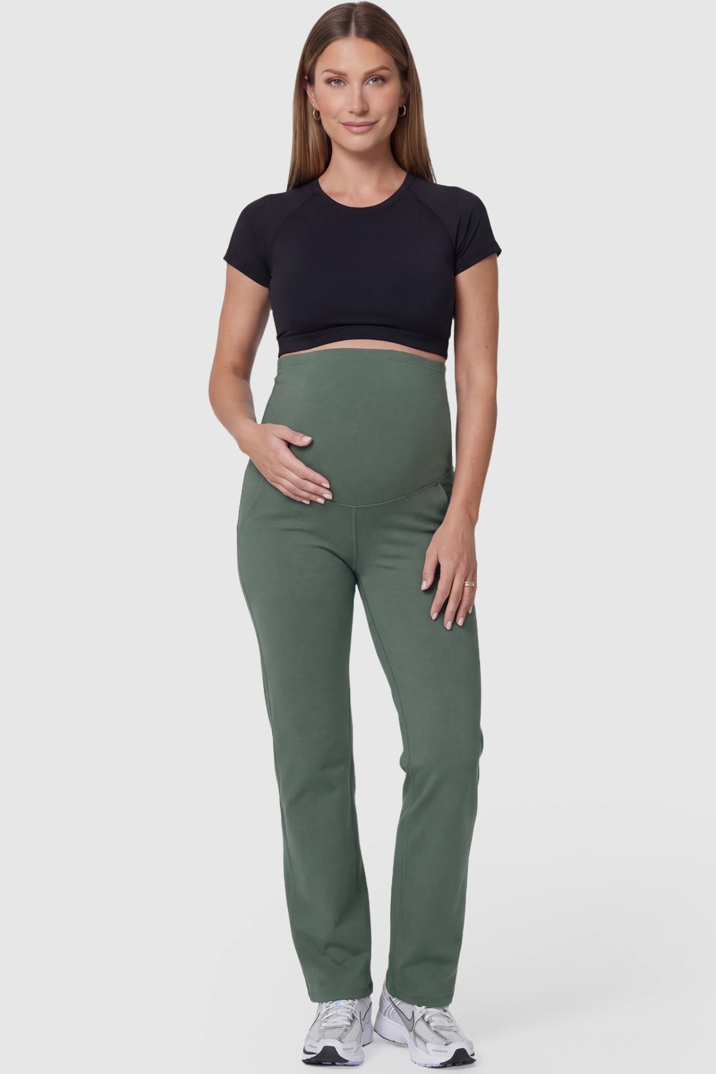Suede-Finish High-Waisted Straight Leg Yoga Maternity Pants Suede-finish high-waisted straight leg yoga maternity pants in gray-green with straight leg cut, full body on pregnant model