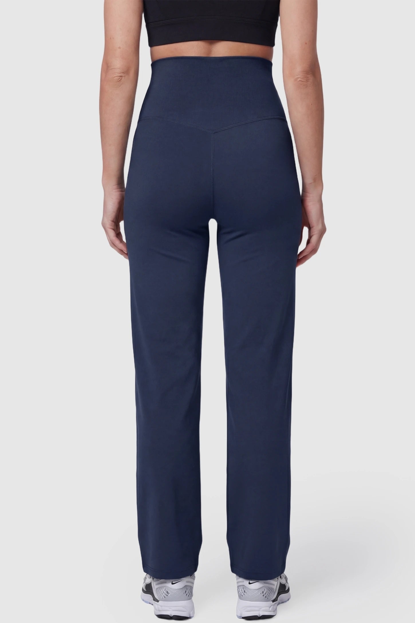 Suede-Finish High-Waisted Straight Leg Yoga Maternity Pants Suede-finish high-waisted straight leg yoga maternity pants in navy blue with straight-leg cut, back view on pregnant model