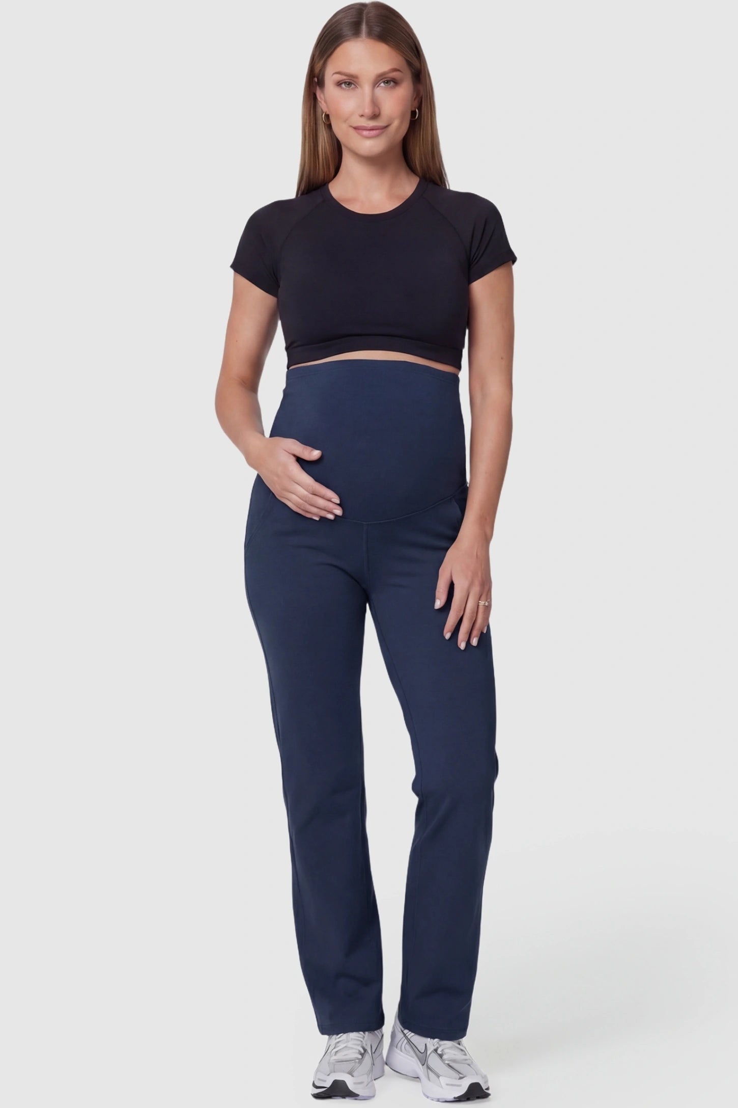 Suede-Finish High-Waisted Straight Leg Yoga Maternity Pants Suede-finish high-waisted straight leg yoga maternity pants in navy blue with straight leg cut, full body on pregnant model