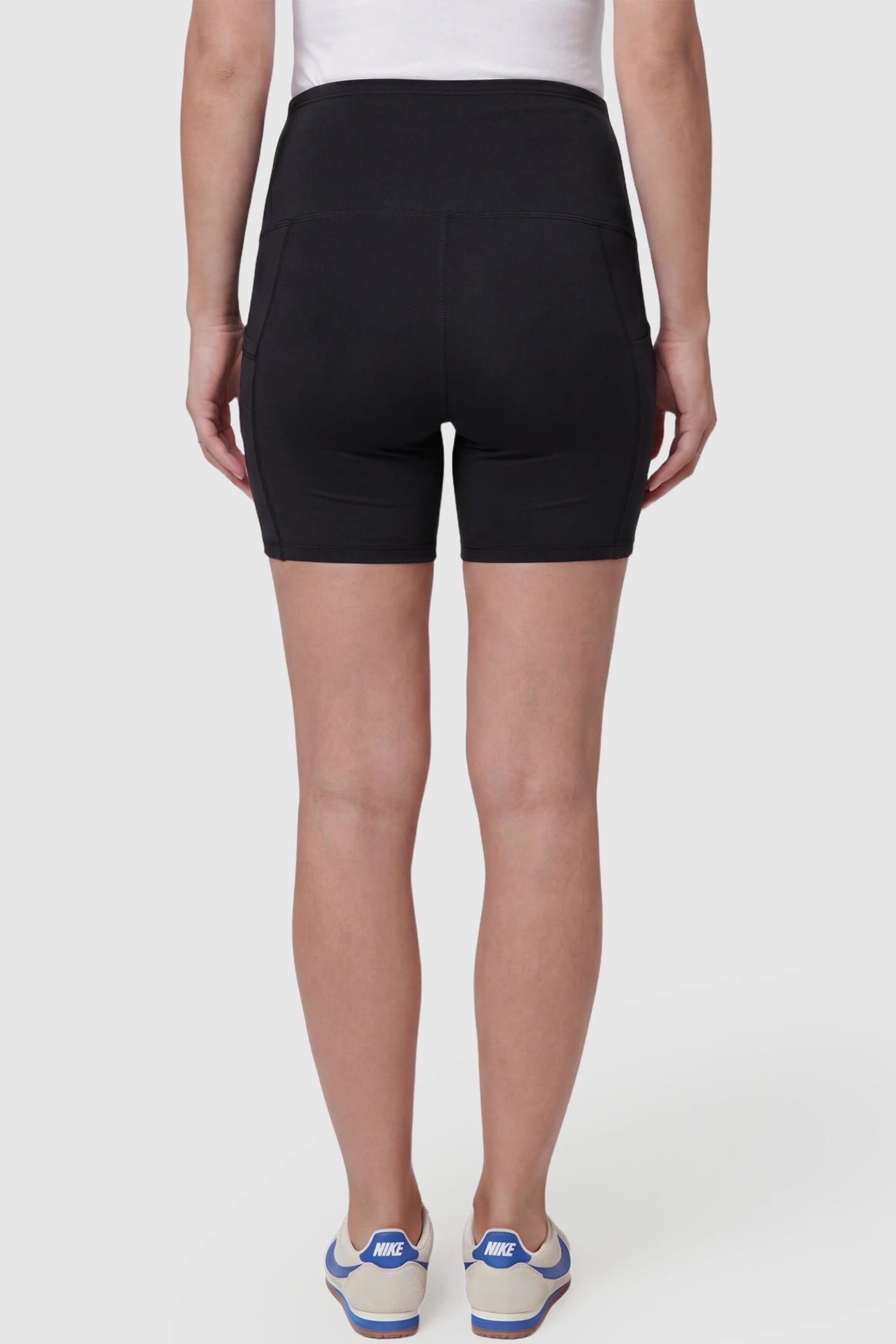 High-Waist Tummy Support Body-Hugging Maternity Shorts High-waist tummy support body-hugging maternity shorts in black with smooth rear design, back view on pregnant model