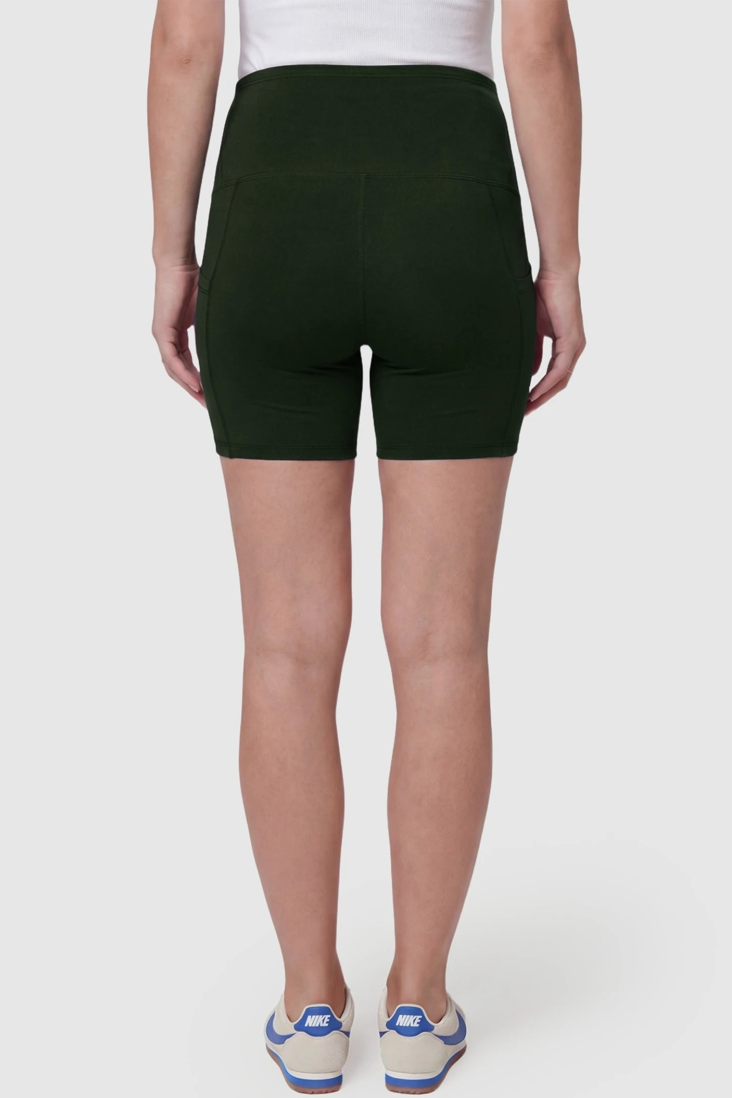 High-Waist Tummy Support Body-Hugging Maternity Shorts High-waist tummy support body-hugging maternity shorts in dark green with smooth rear design, back view on pregnant model