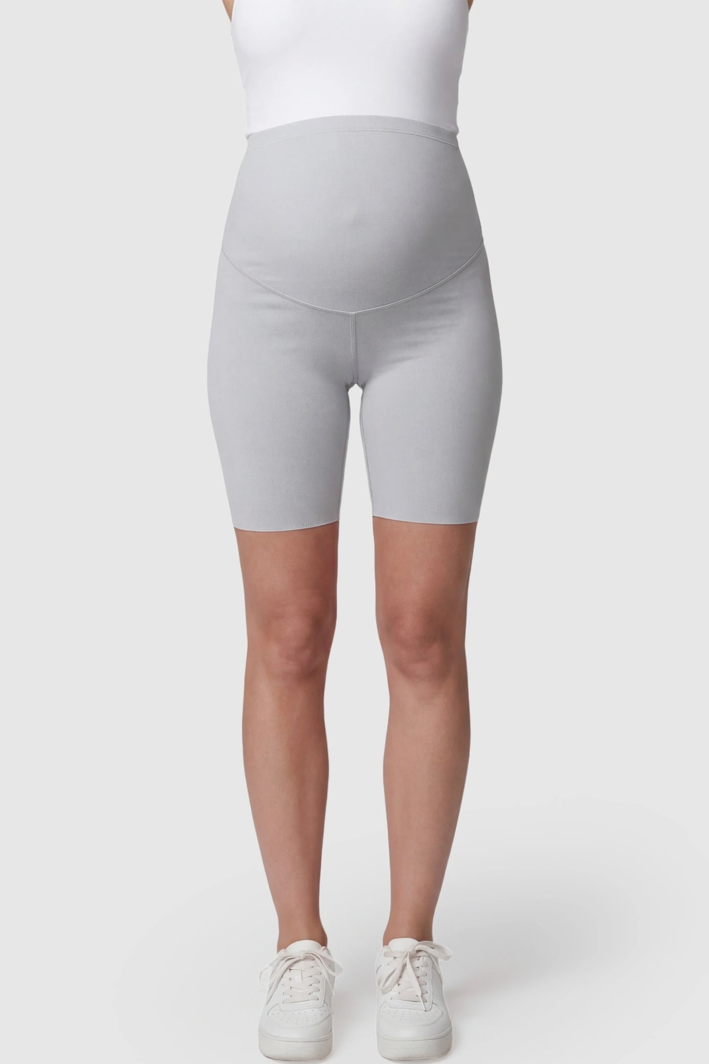 High-Waist Belly Support Slim Fit Shark Maternity Shorts High-waist belly support slim fit shark maternity shorts in light gray with supportive waistband, front view on pregnant model