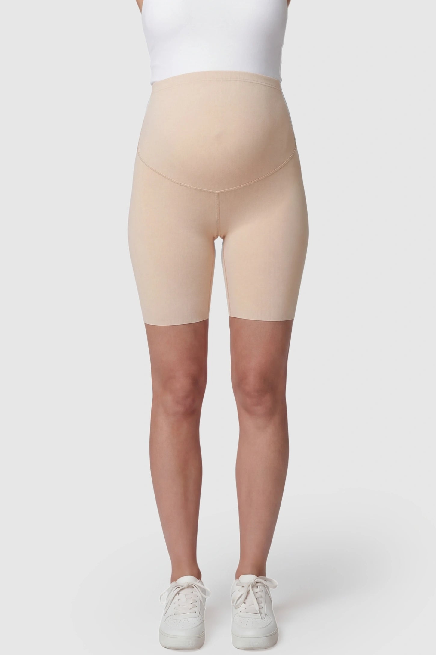 High-Waist Belly Support Slim Fit Shark Maternity Shorts High-waist belly support slim fit shark maternity shorts in skin tone with supportive waistband, front view on pregnant model