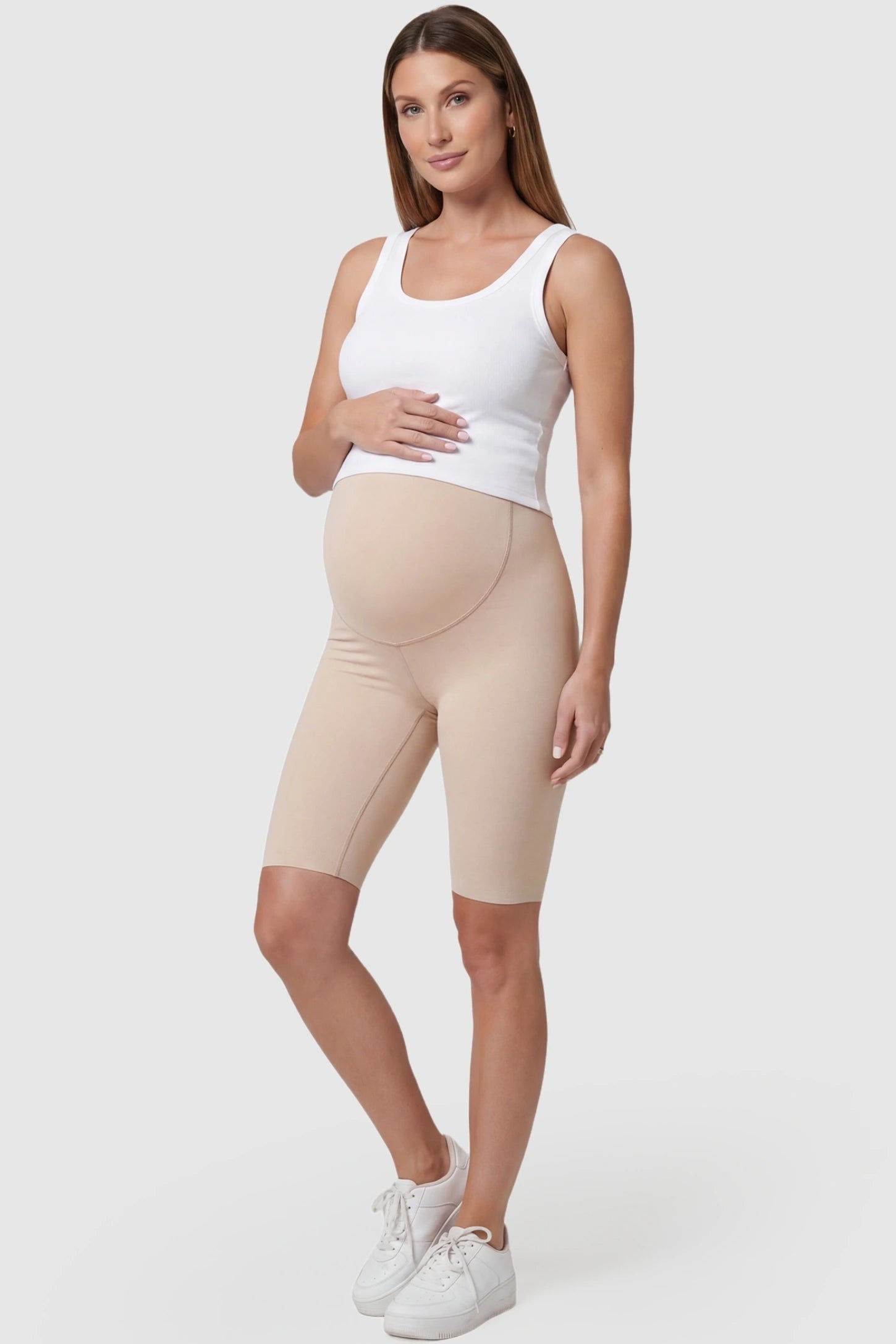 High-Waist Belly Support Slim Fit Shark Maternity Shorts High-waist belly support slim fit shark maternity shorts in skin tone with slim silhouette, full body on pregnant model