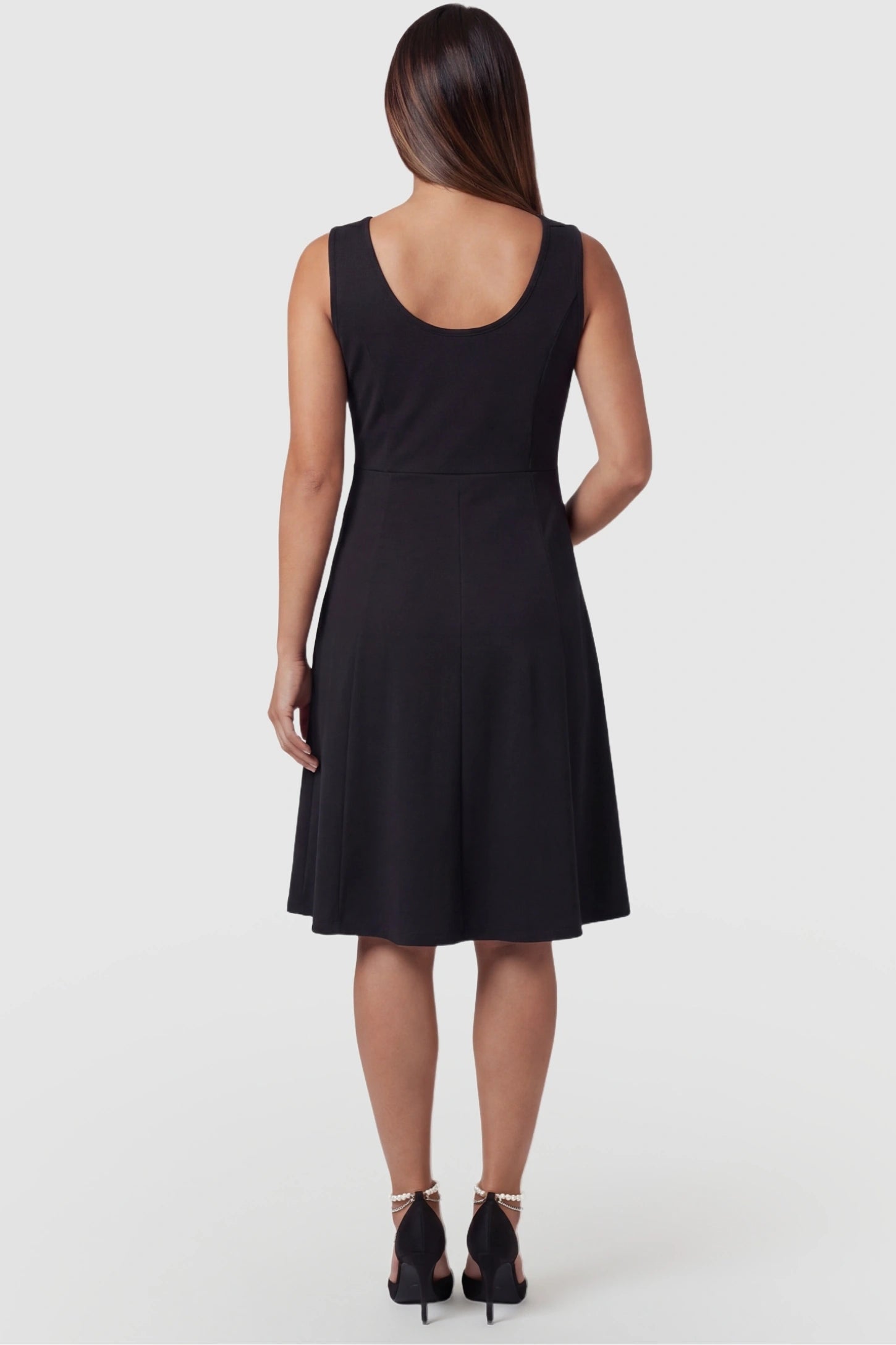Zip-Up Nursing Access A-Line Maternity Tank Dress Zip-Up Nursing Access A-Line Maternity Tank Dress in Black featuring a classic U-back design on a pregnant model, back view.