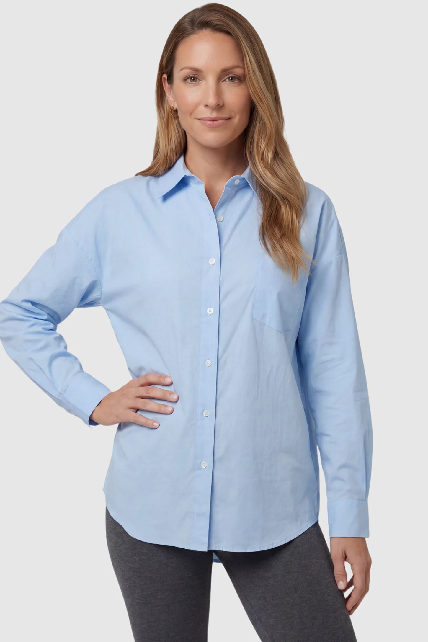 Button Down Collared Maternity Shirt Button Down Collared Maternity Shirt in light blue featuring long sleeves and a crisp cotton finish on a postpartum model, front view.