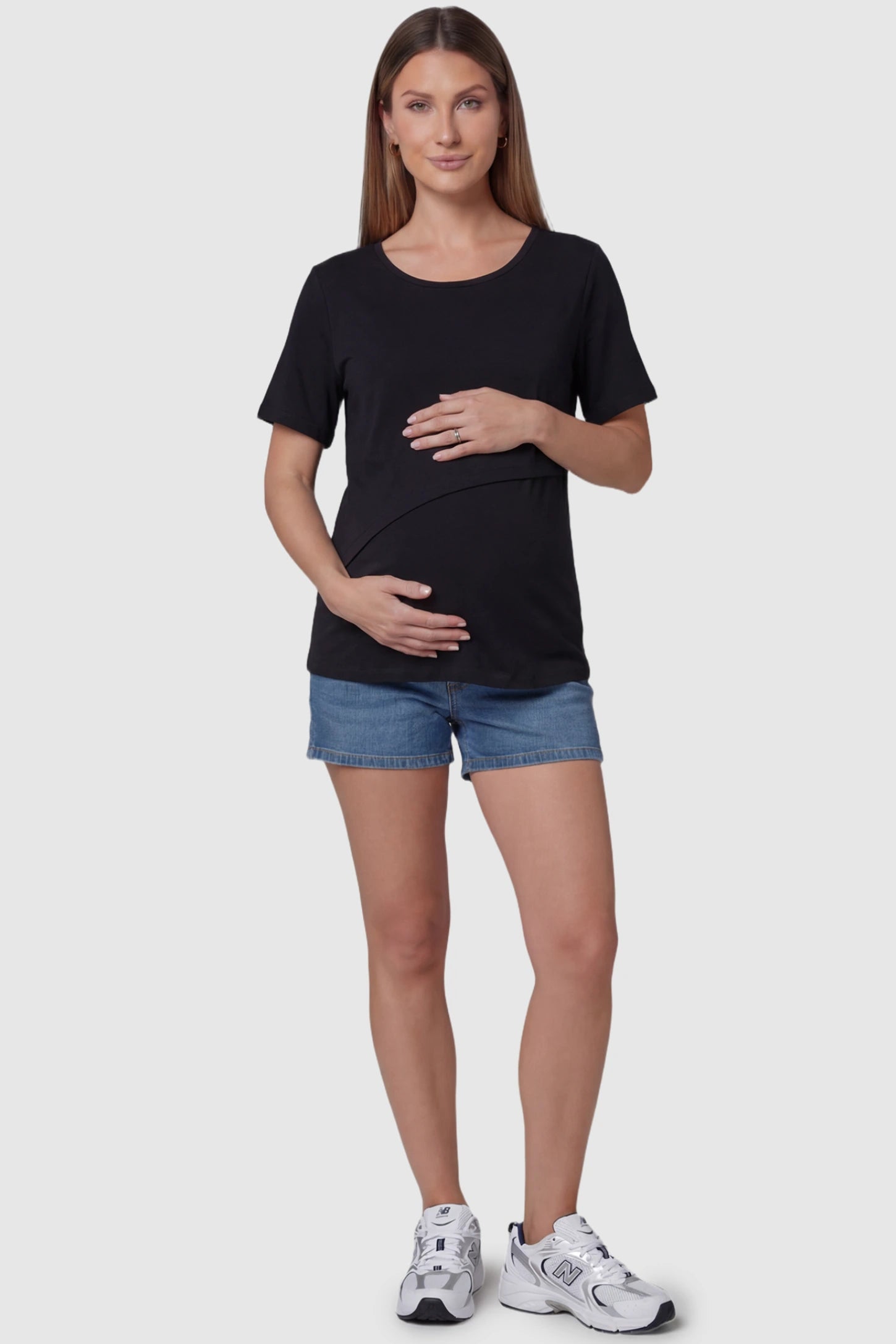 Double Layer Short Sleeve Maternity Nursing Top Double Layer Short Sleeve Maternity Nursing Top in Black featuring a discreet lift-up layer on a pregnant model full body view.