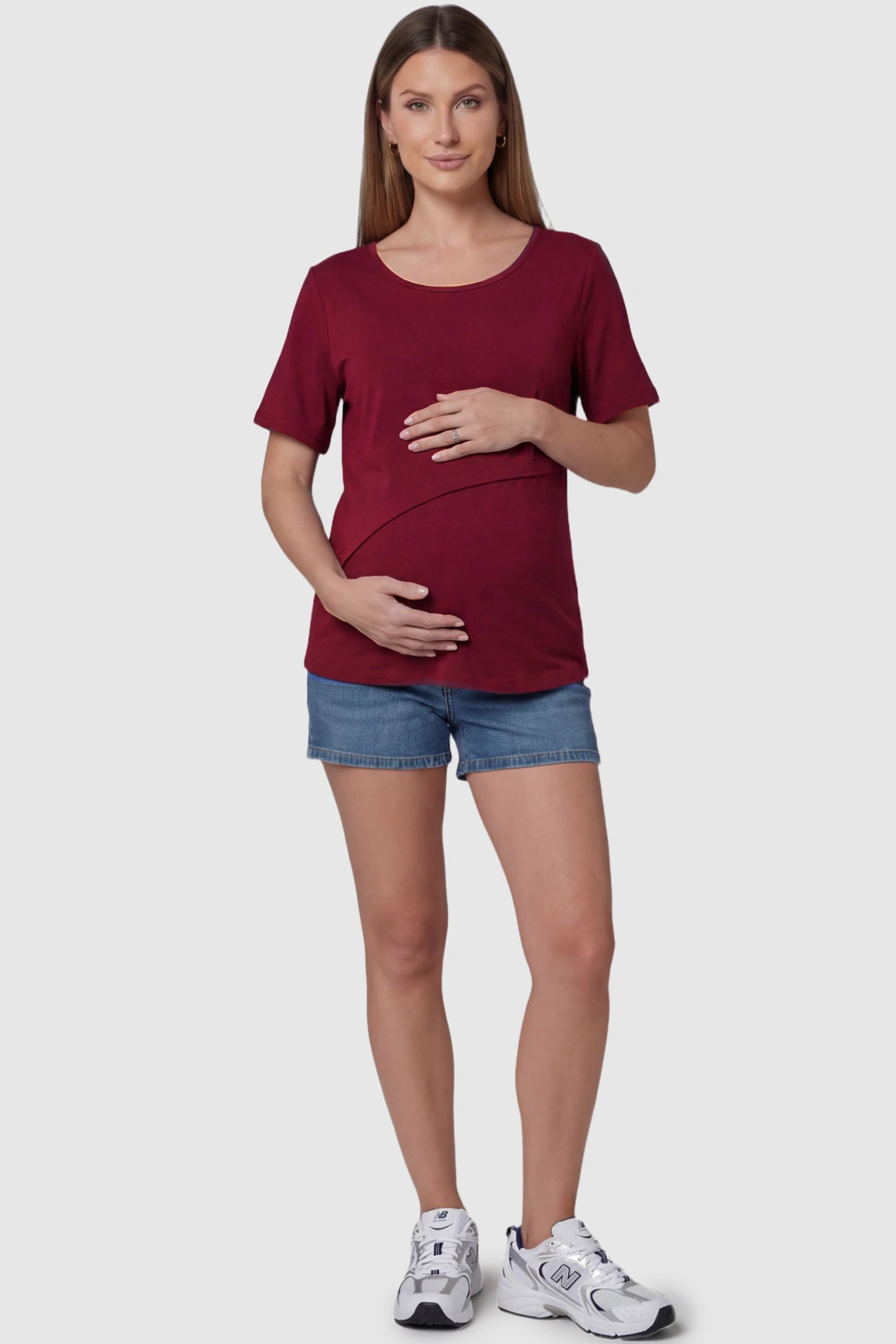 Double Layer Short Sleeve Maternity Nursing Top Double Layer Short Sleeve Maternity Nursing Top in Wine Red featuring a discreet lift-up layer on a pregnant model full body view.