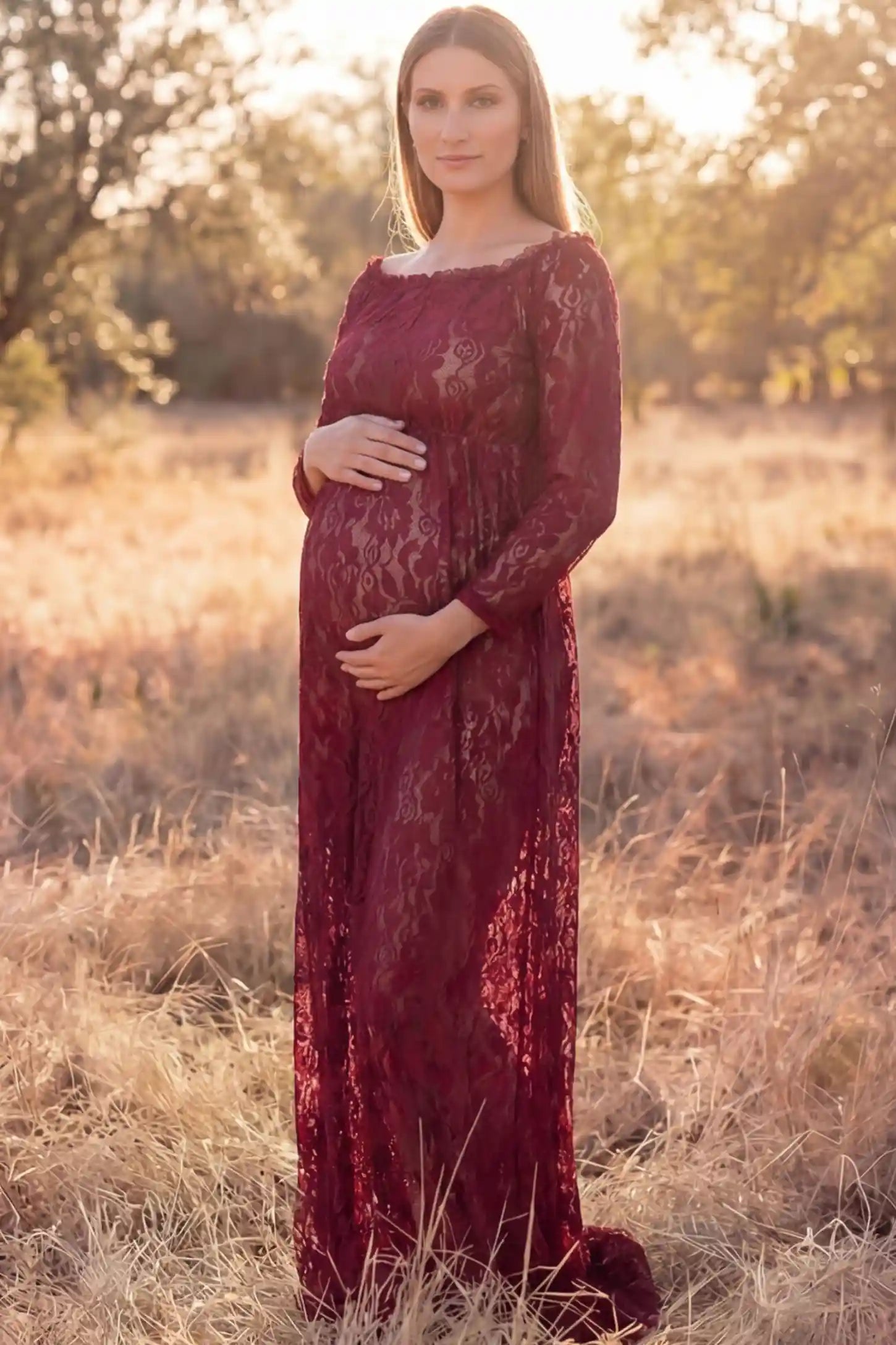 Lace Long Sleeve Maternity Photoshoot Dress Lace Long Sleeve Maternity Gown in burgundy featuring scalloped lace trim neckline on pregnant model showing front view.